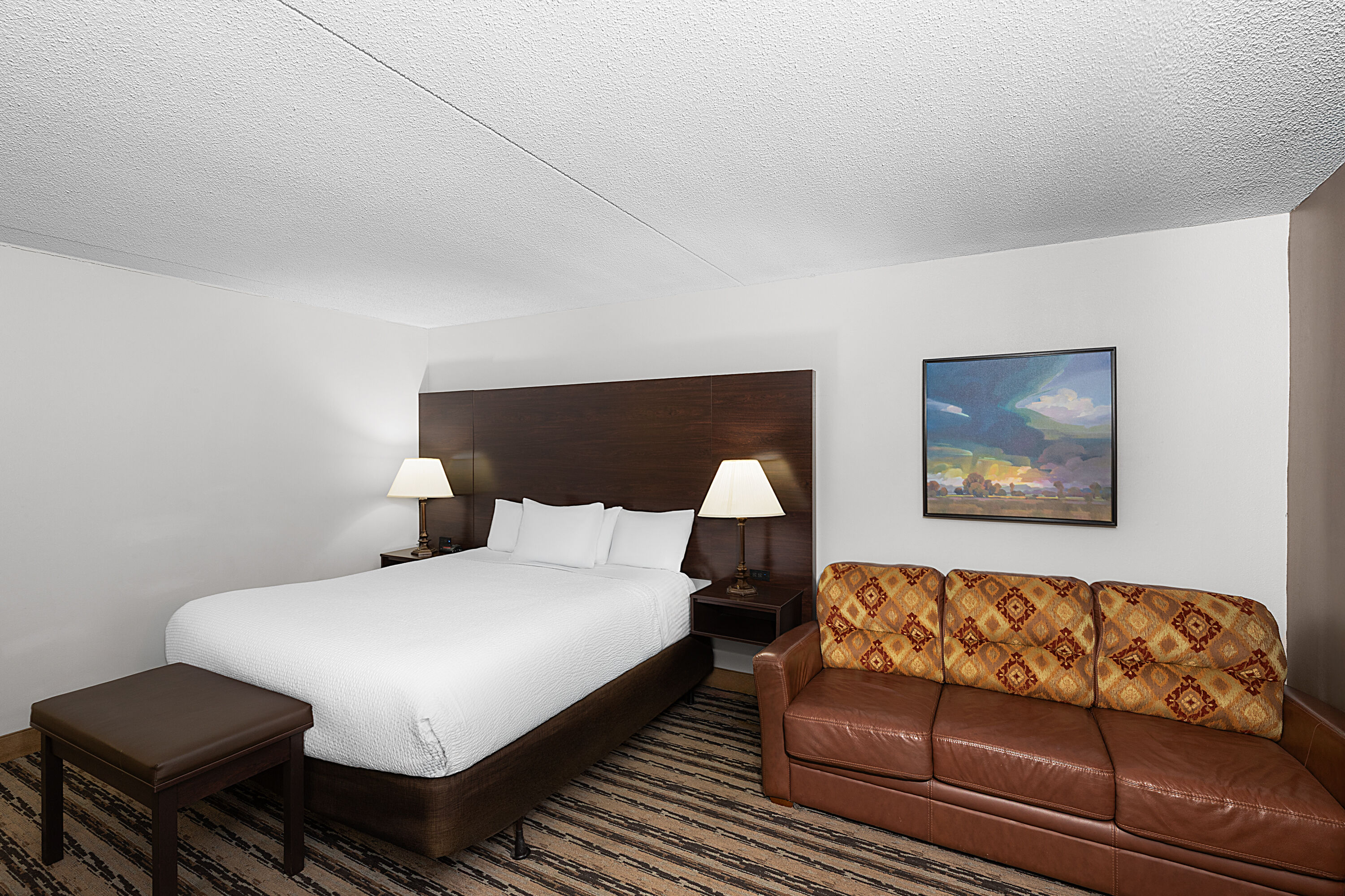 Guest room at the Endeavor Inn & Suites, Trademark Collection by Wyndham in Topeka, Kansas