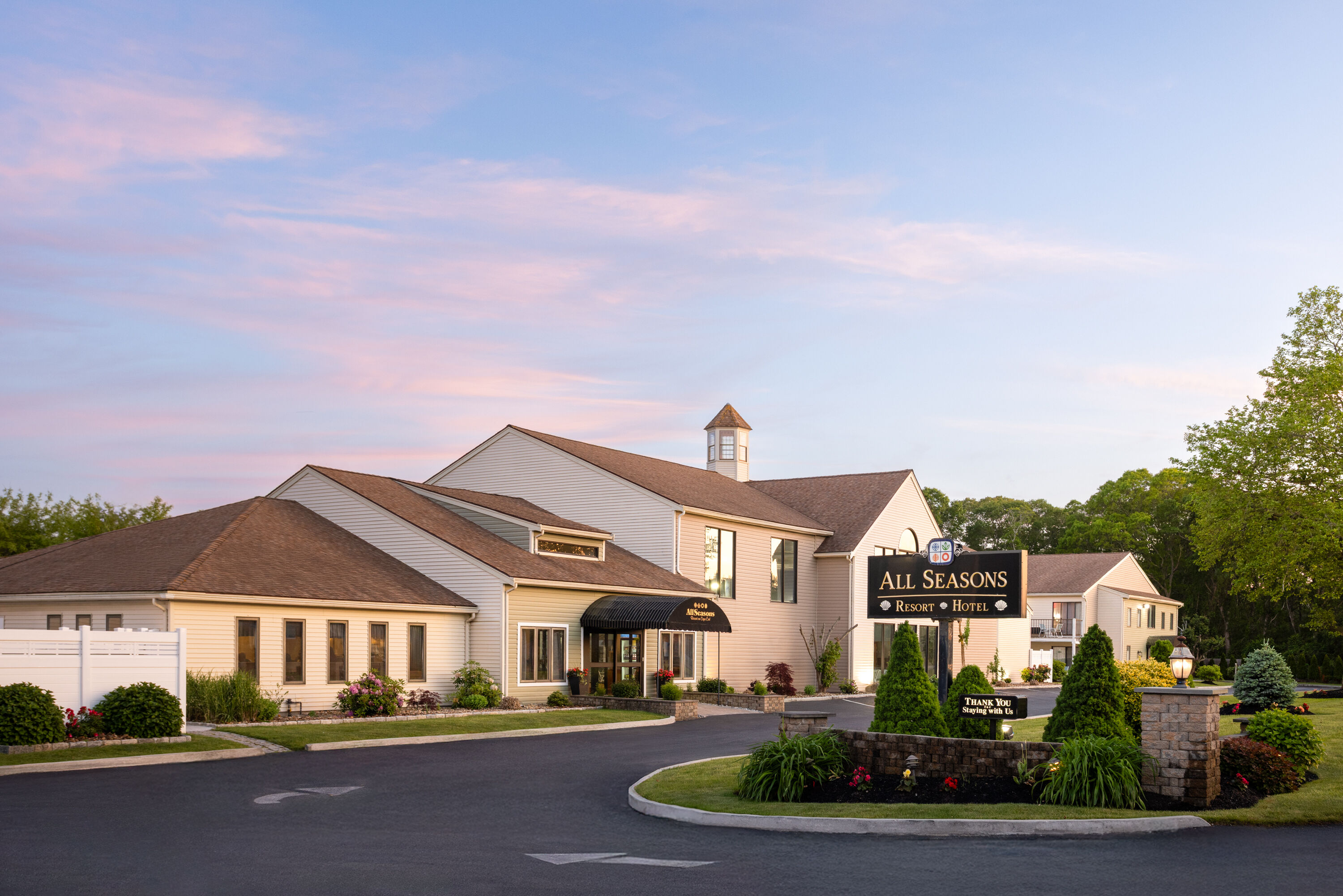 Exterior Dusk Image of All Seasons Resort, Trademark Collection by Wyndham hotel in South Yarmouth, Massachusetts