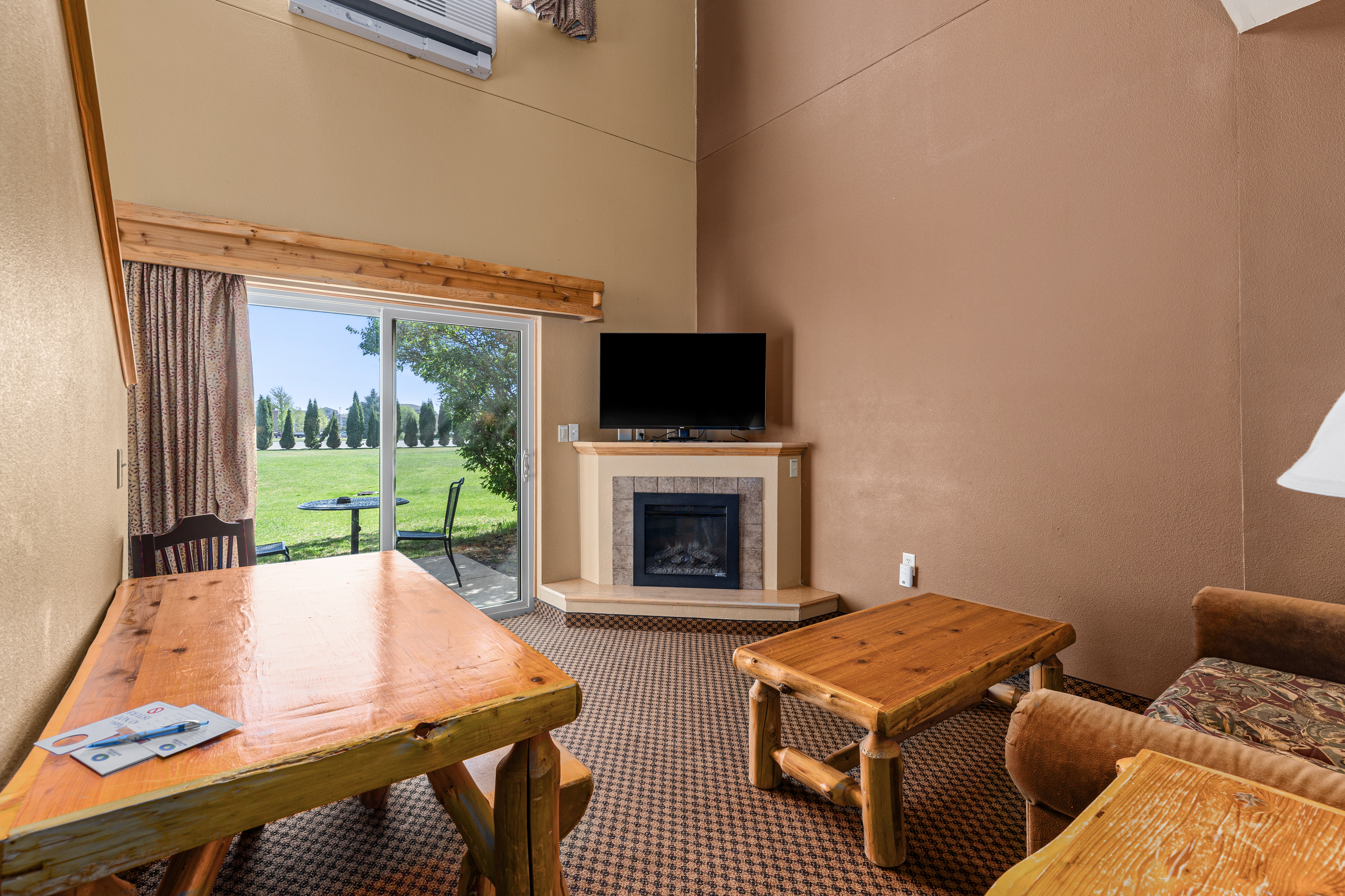Queen bed guest room at the The Lodge at Brainerd Lakes, Trademark Collection by Wyndham in Baxter, Minnesota