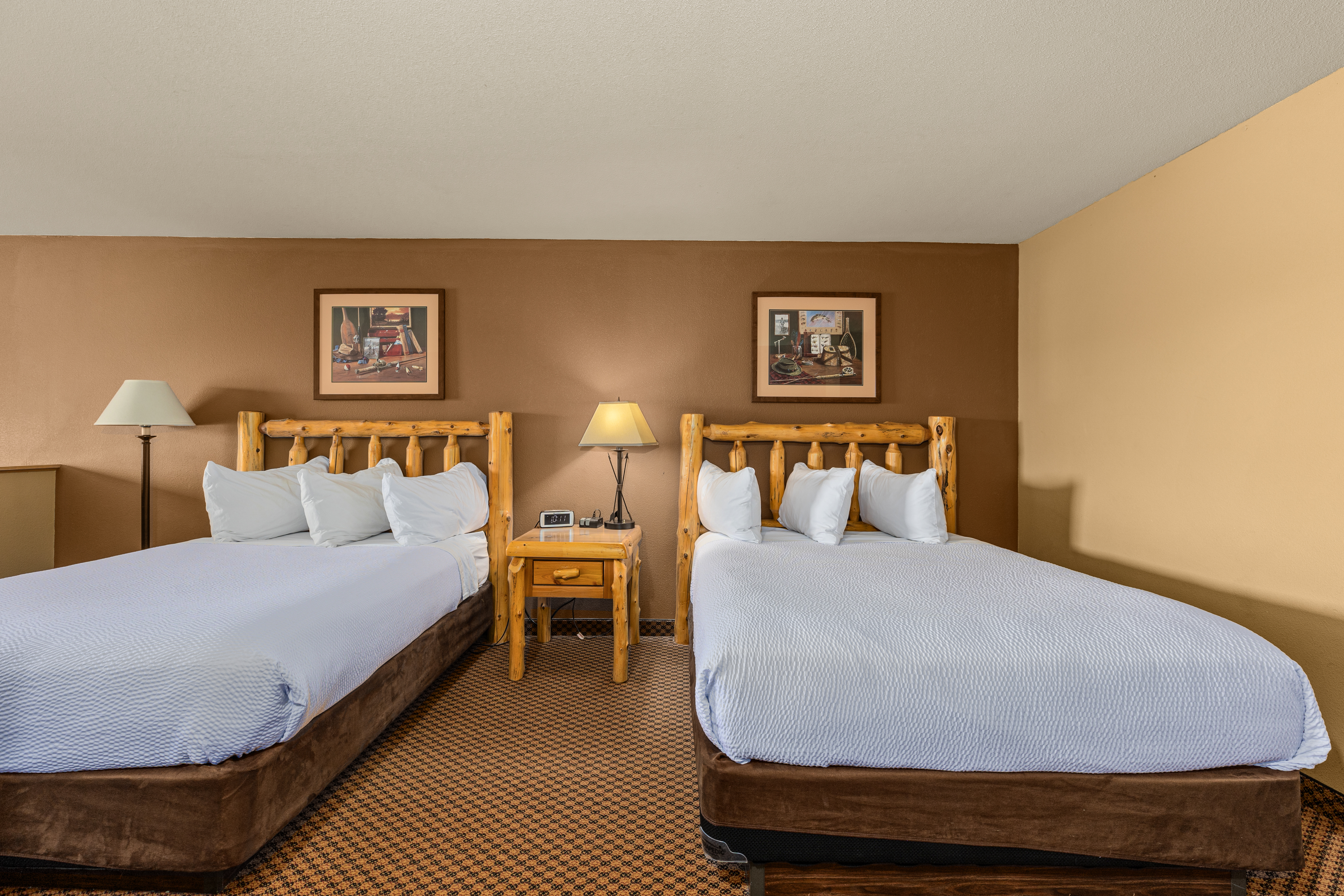 Queen bed guest room at the The Lodge at Brainerd Lakes, Trademark Collection by Wyndham in Baxter, Minnesota