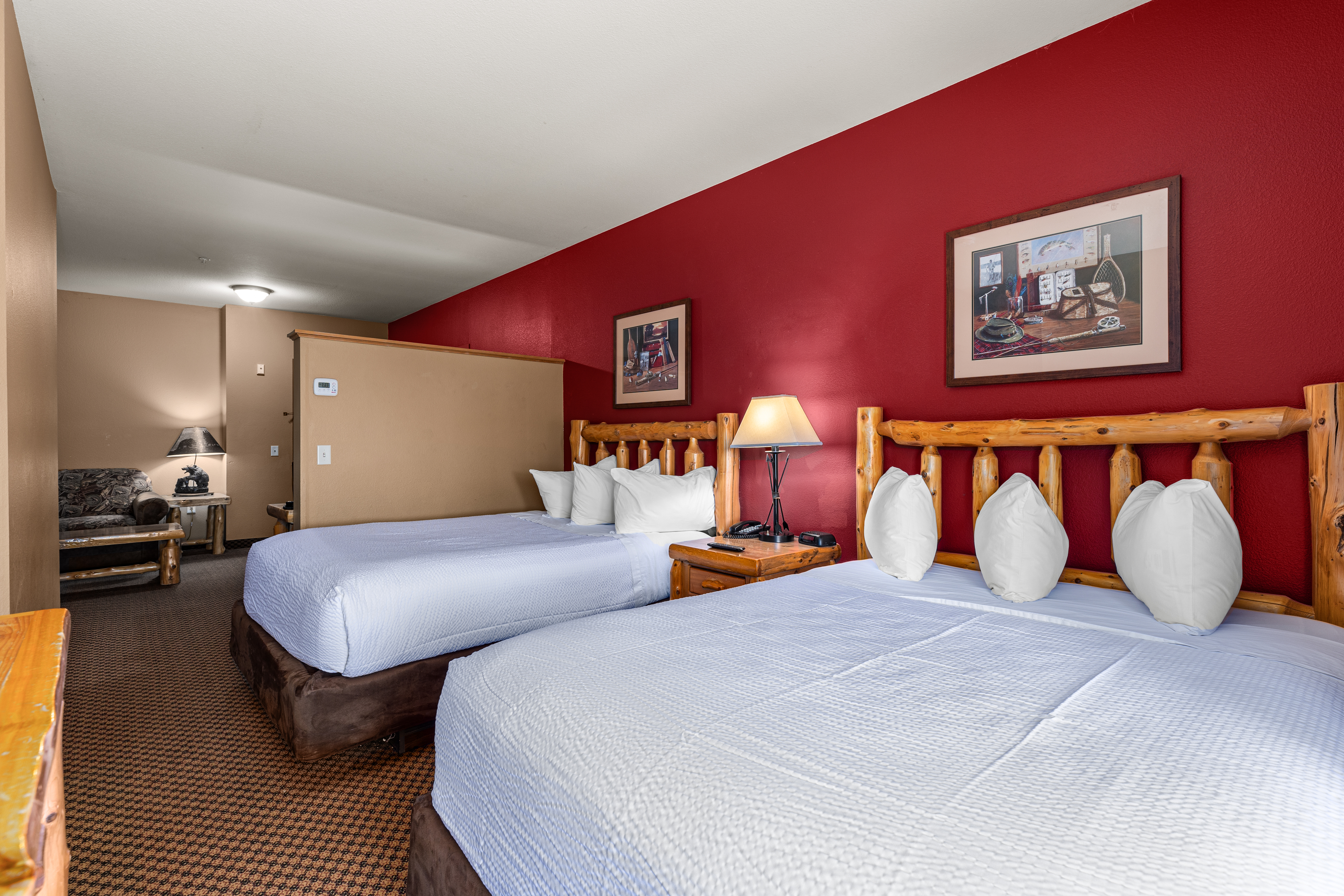 Queen bed guest room at the The Lodge at Brainerd Lakes, Trademark Collection by Wyndham in Baxter, Minnesota
