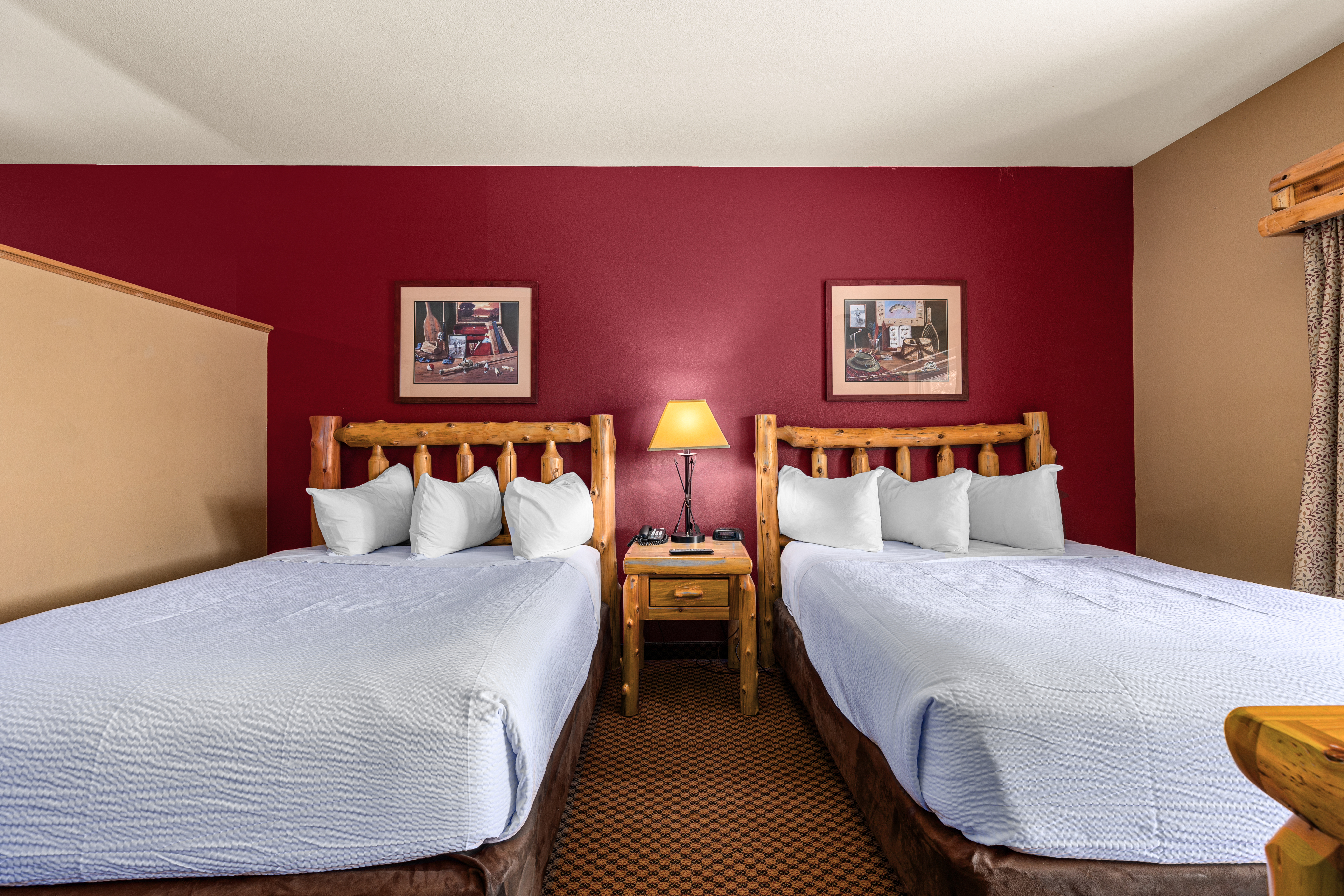 Queen bed guest room at the The Lodge at Brainerd Lakes, Trademark Collection by Wyndham in Baxter, Minnesota