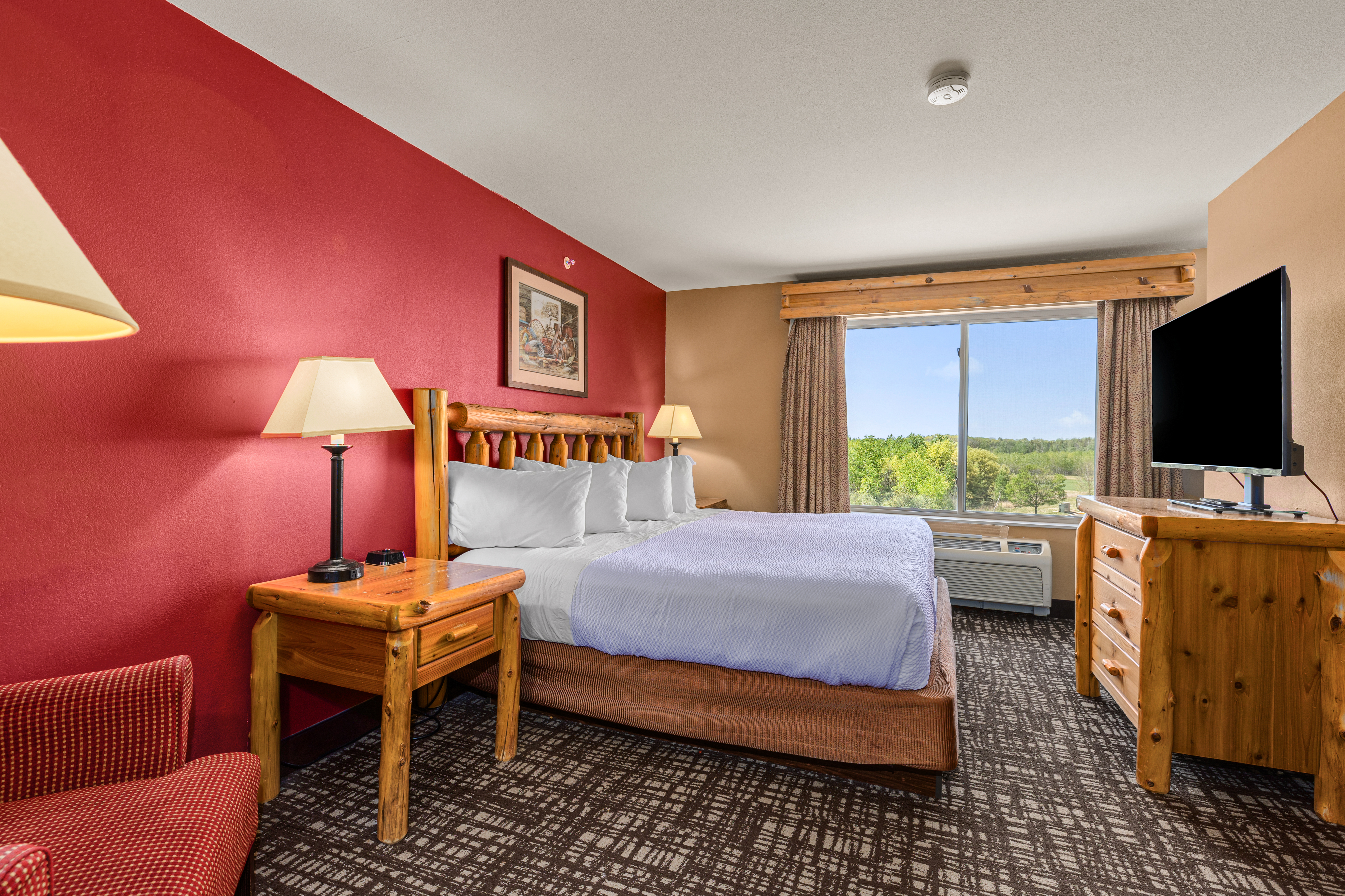 King bed guest room at the The Lodge at Brainerd Lakes, Trademark Collection by Wyndham in Baxter, Minnesota