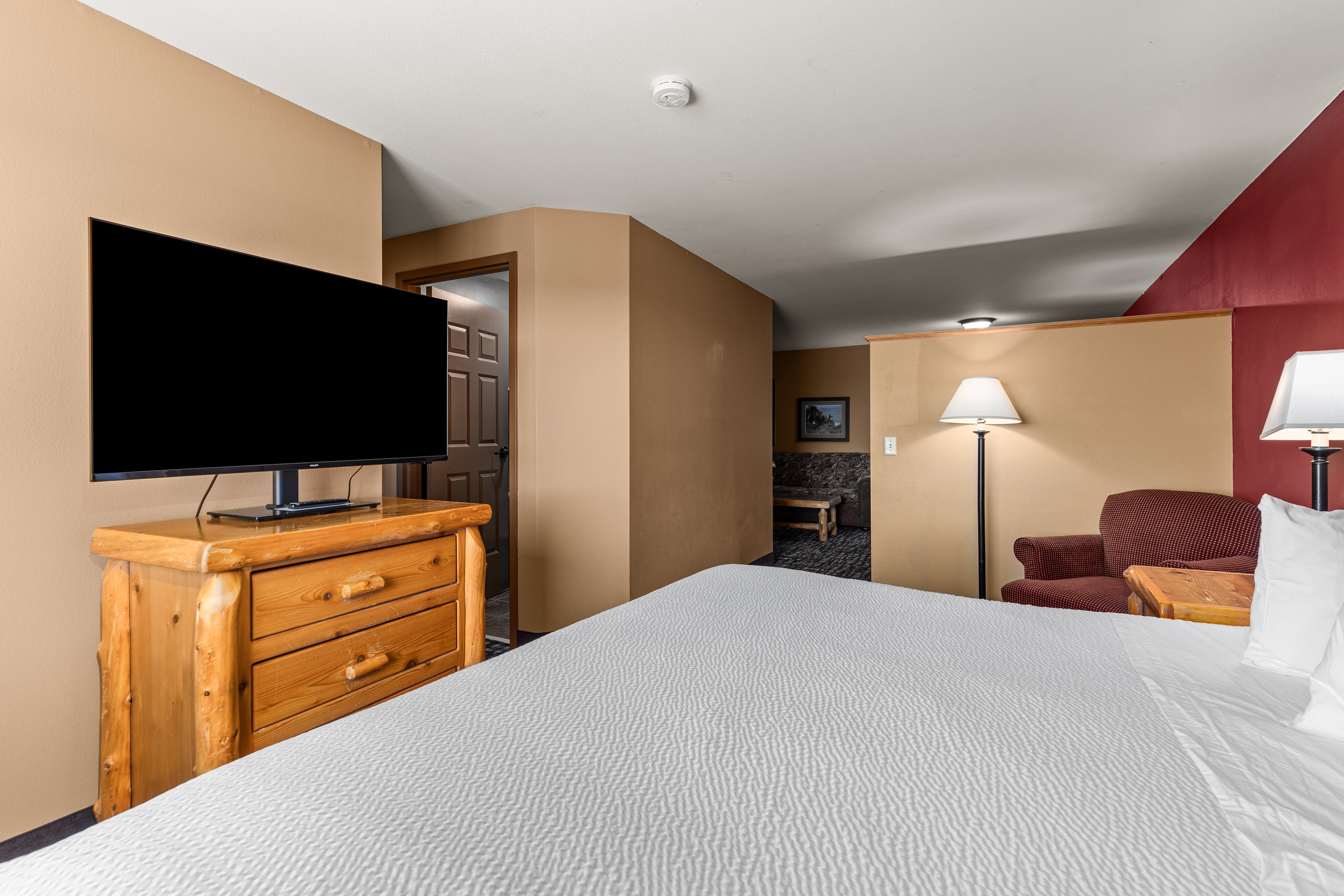 King bed guest room at the The Lodge at Brainerd Lakes, Trademark Collection by Wyndham in Baxter, Minnesota