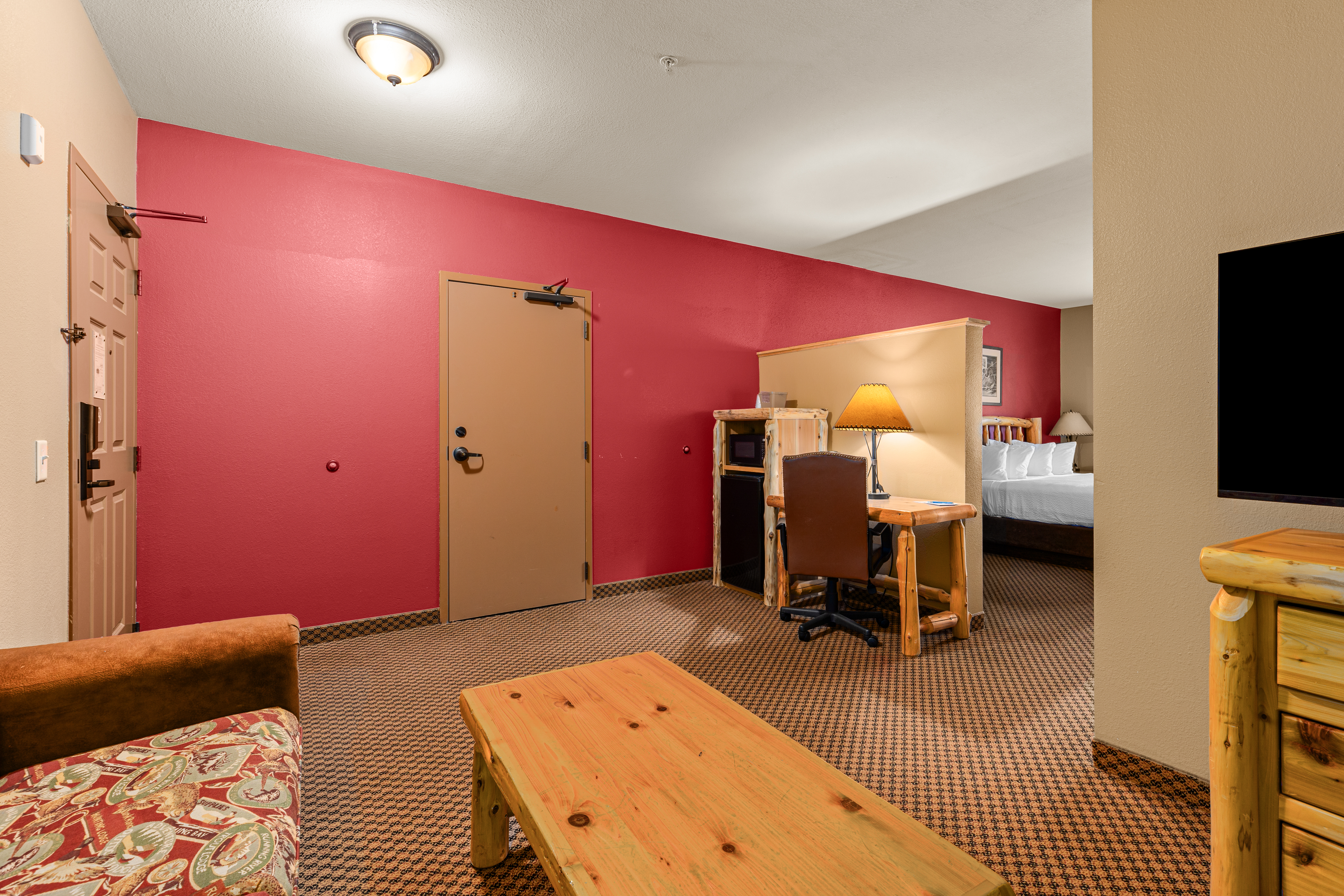 King bed guest room at the The Lodge at Brainerd Lakes, Trademark Collection by Wyndham in Baxter, Minnesota