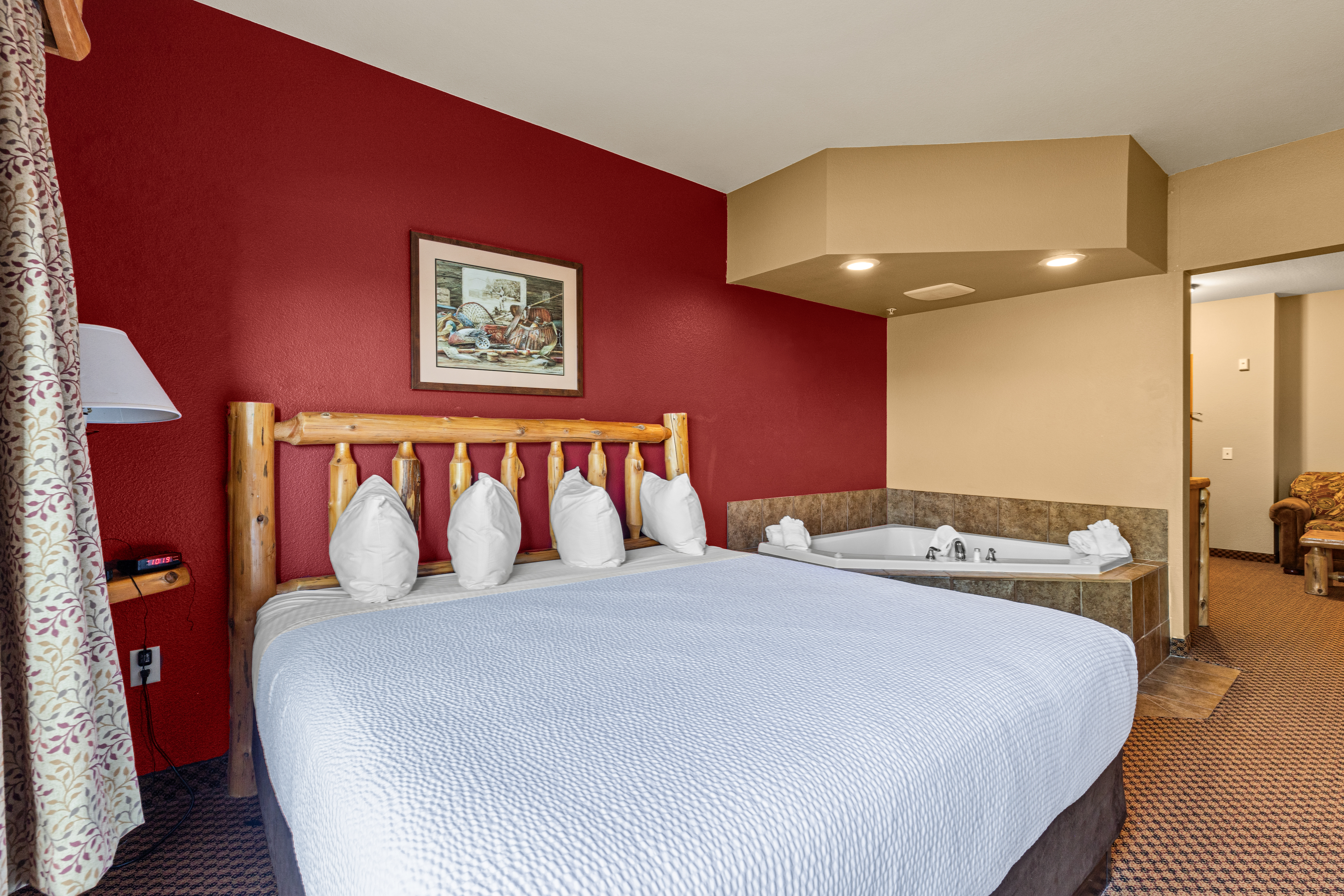 King bed guest room at the The Lodge at Brainerd Lakes, Trademark Collection by Wyndham in Baxter, Minnesota