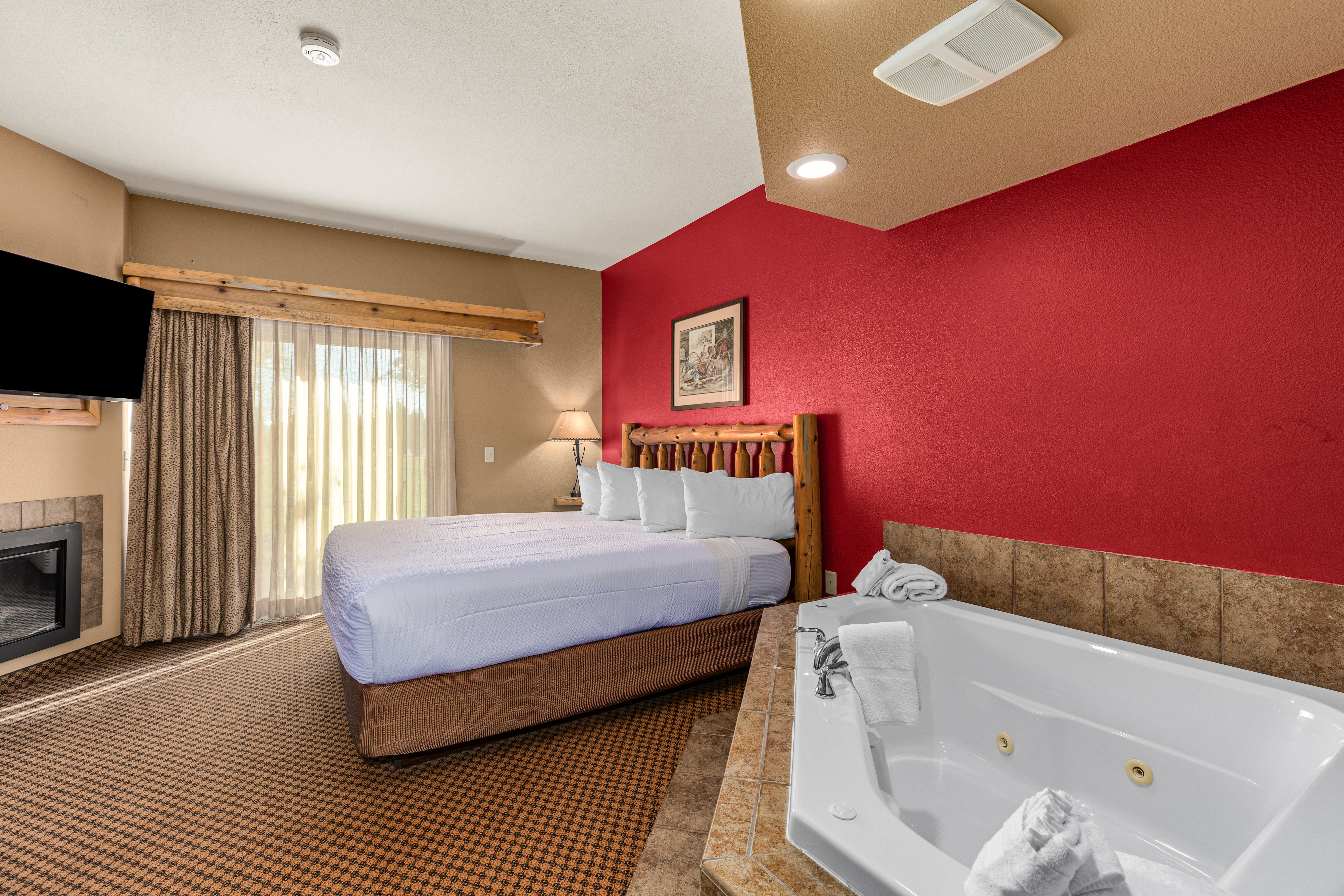 King bed guest room at the The Lodge at Brainerd Lakes, Trademark Collection by Wyndham in Baxter, Minnesota