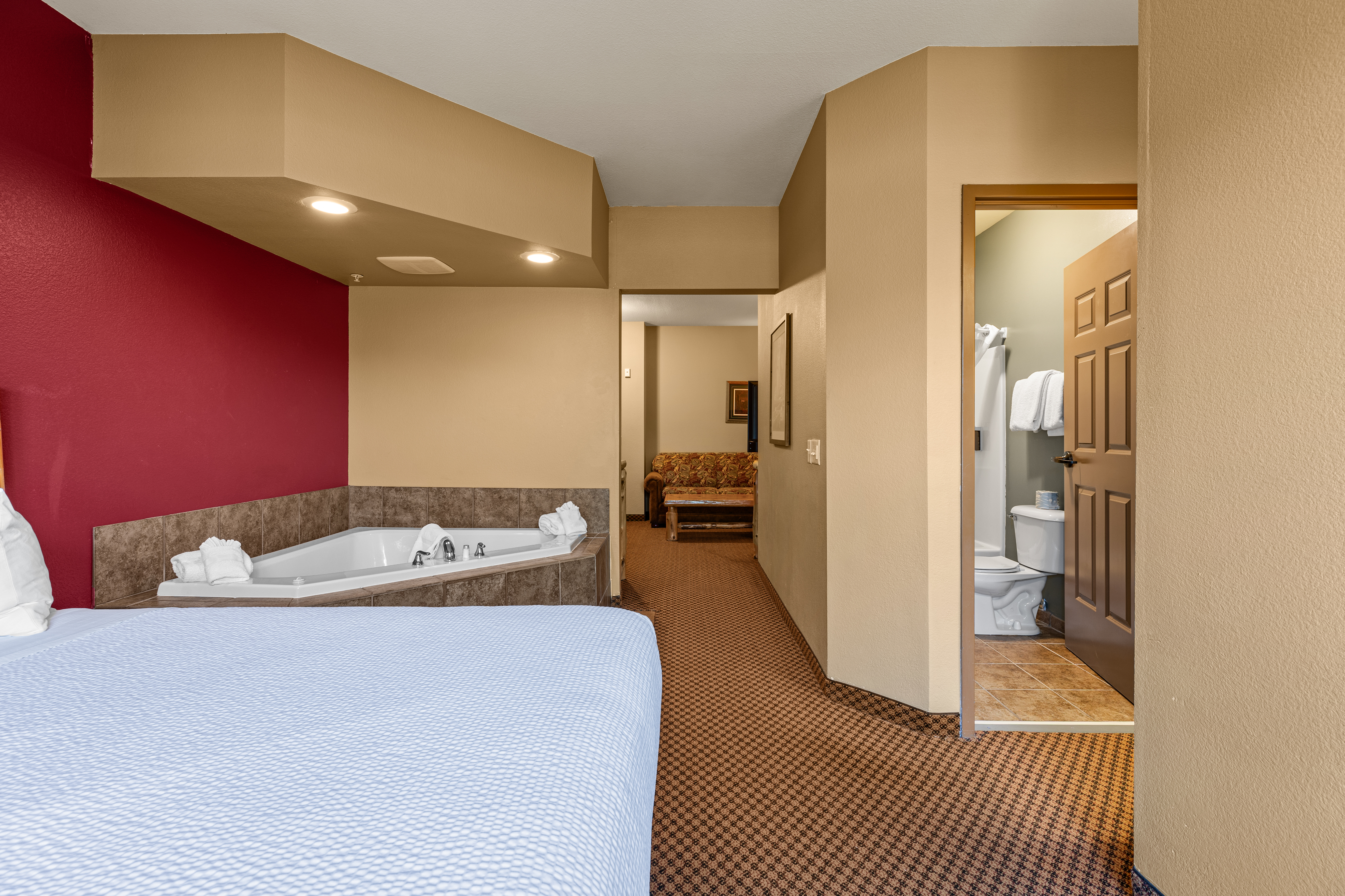 King bed guest room at the The Lodge at Brainerd Lakes, Trademark Collection by Wyndham in Baxter, Minnesota
