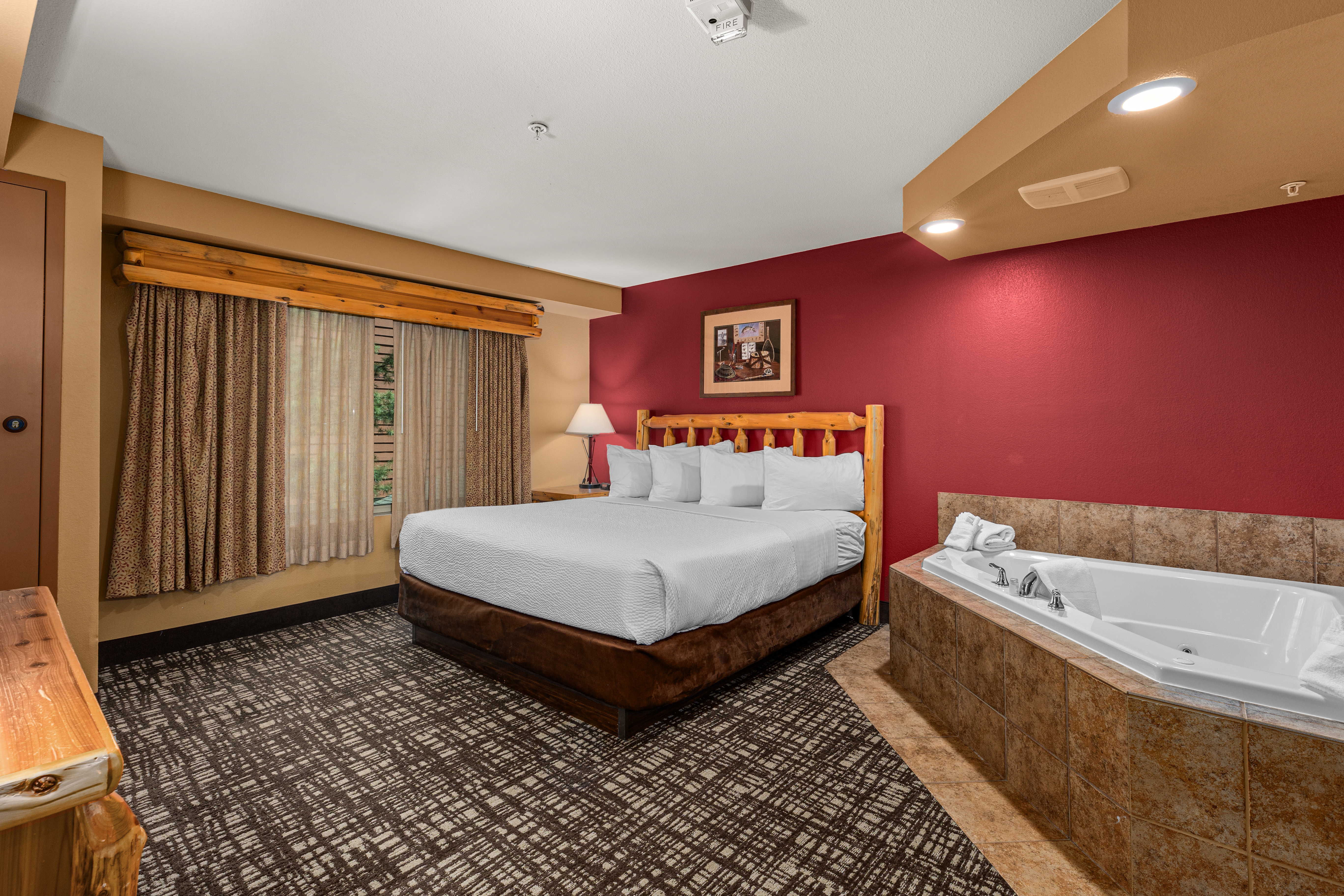 King bed guest room at the The Lodge at Brainerd Lakes, Trademark Collection by Wyndham in Baxter, Minnesota