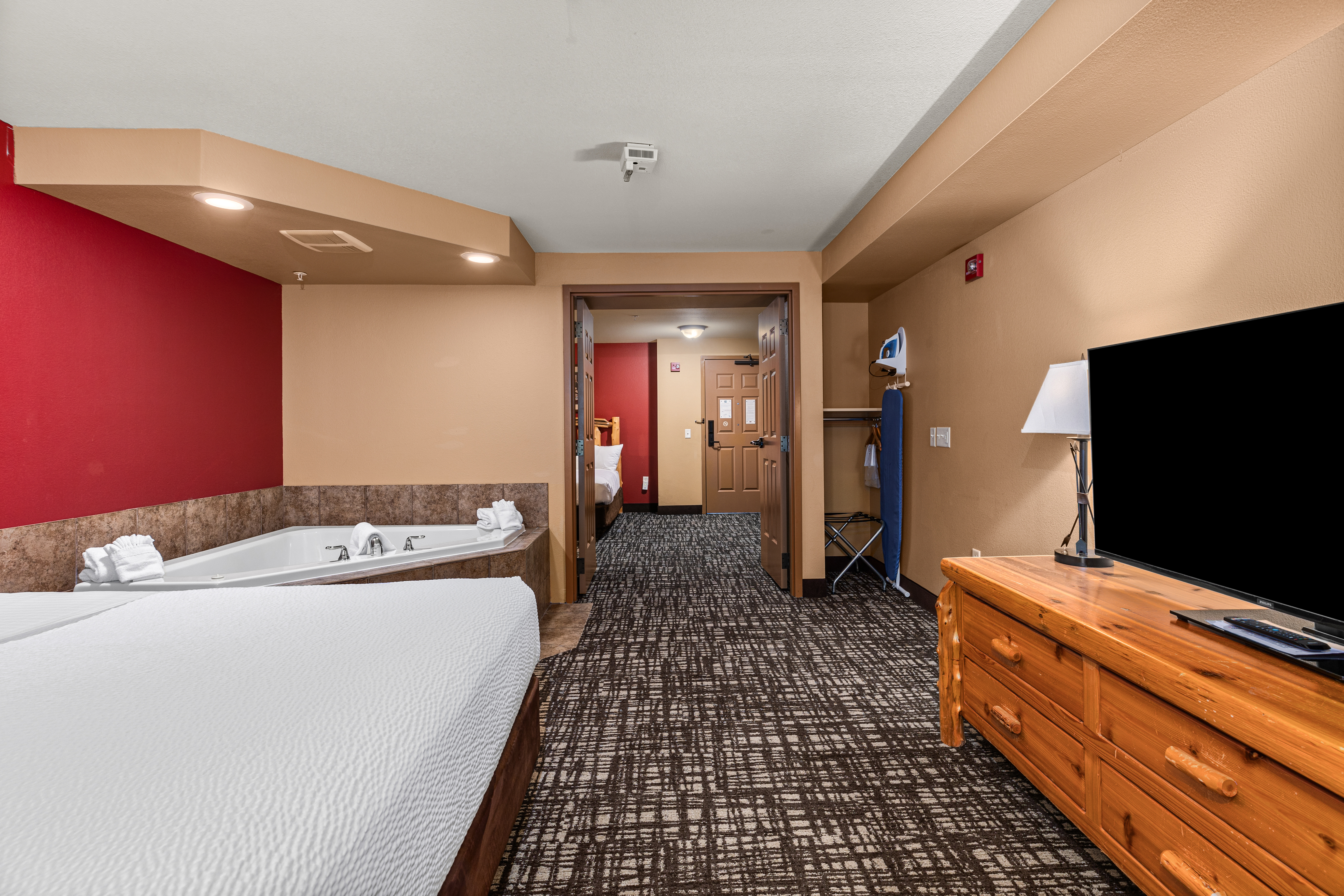King bed guest room at the The Lodge at Brainerd Lakes, Trademark Collection by Wyndham in Baxter, Minnesota