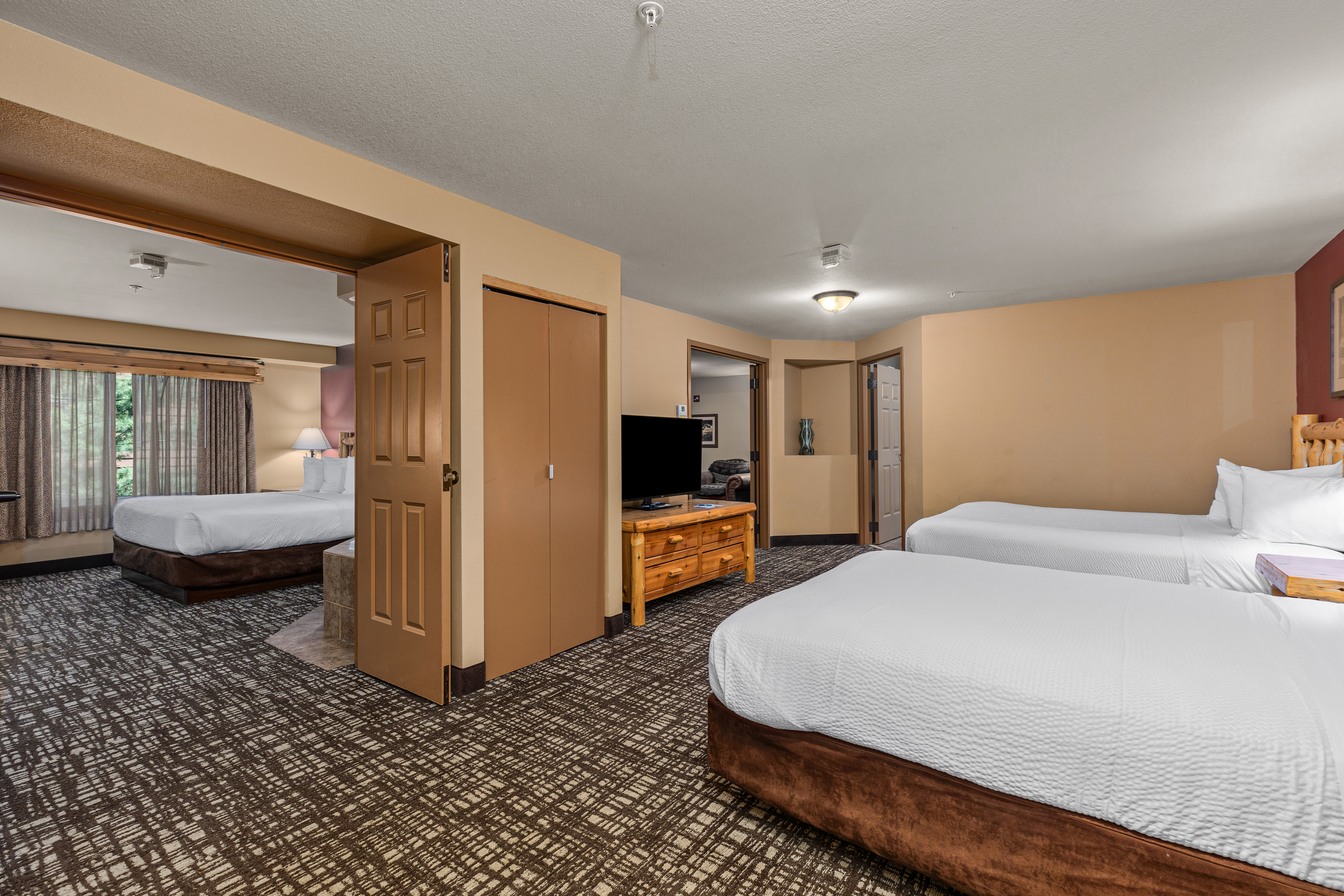 King bed guest room at the The Lodge at Brainerd Lakes, Trademark Collection by Wyndham in Baxter, Minnesota