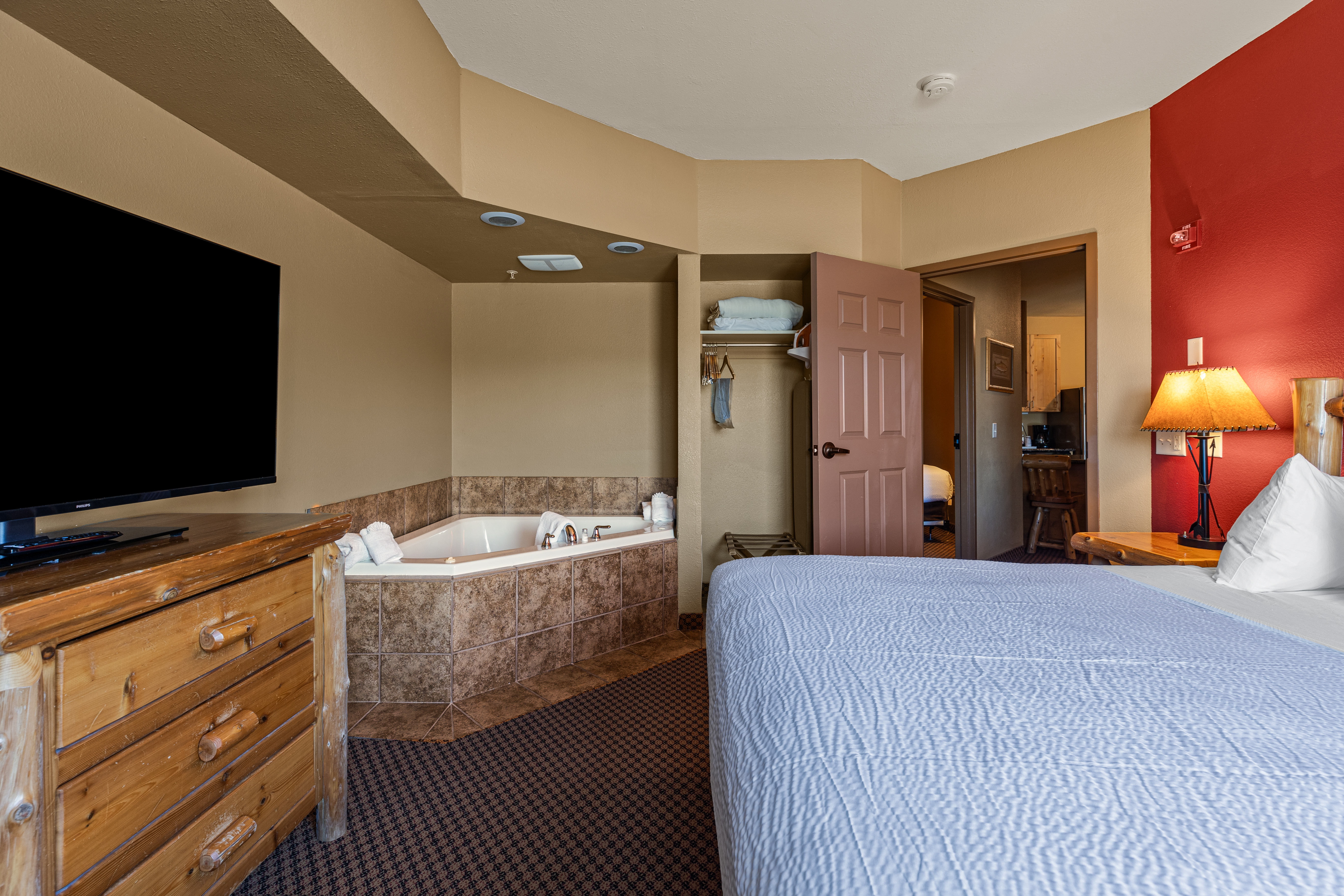 King bed guest room at the The Lodge at Brainerd Lakes, Trademark Collection by Wyndham in Baxter, Minnesota