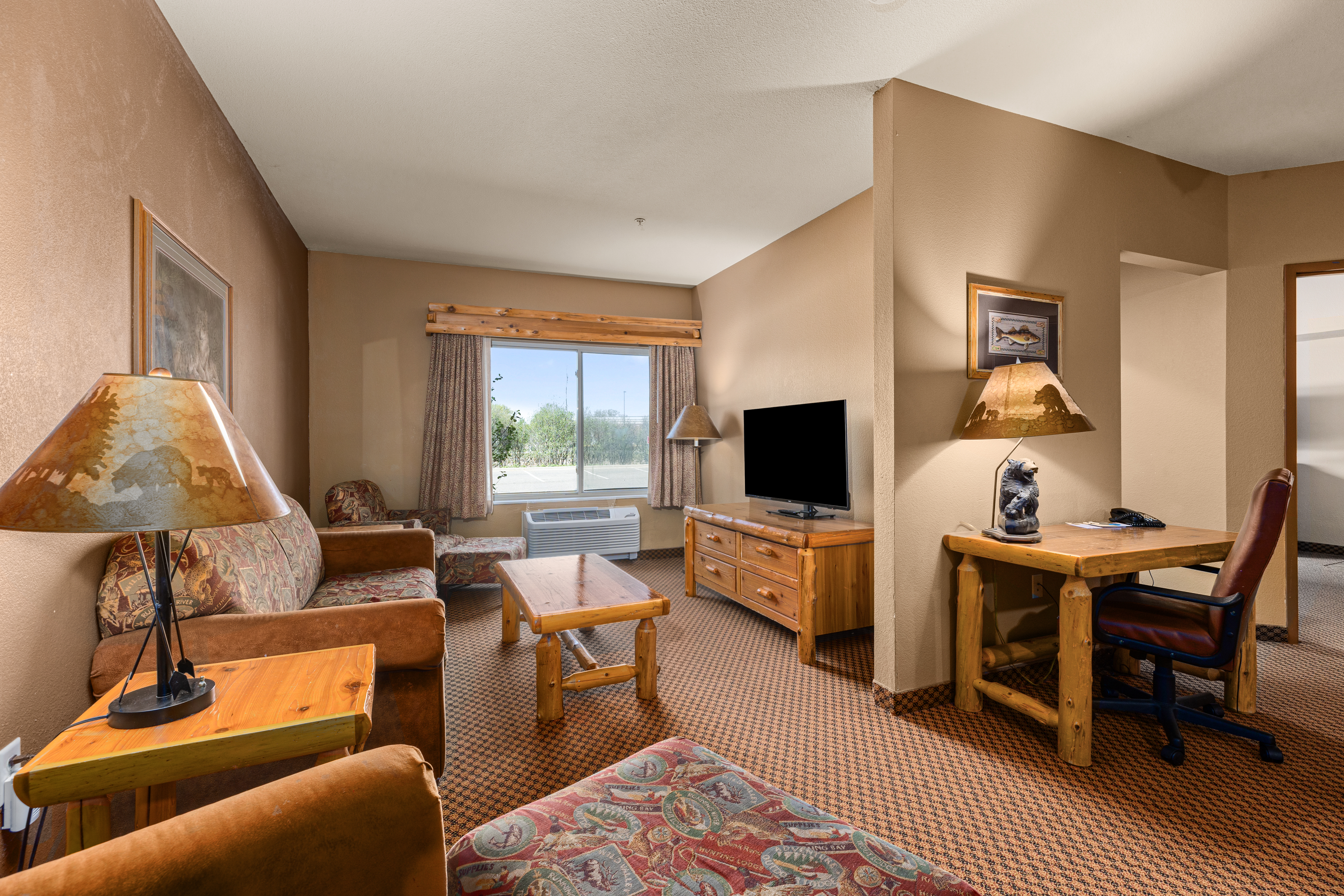 King bed guest room at the The Lodge at Brainerd Lakes, Trademark Collection by Wyndham in Baxter, Minnesota