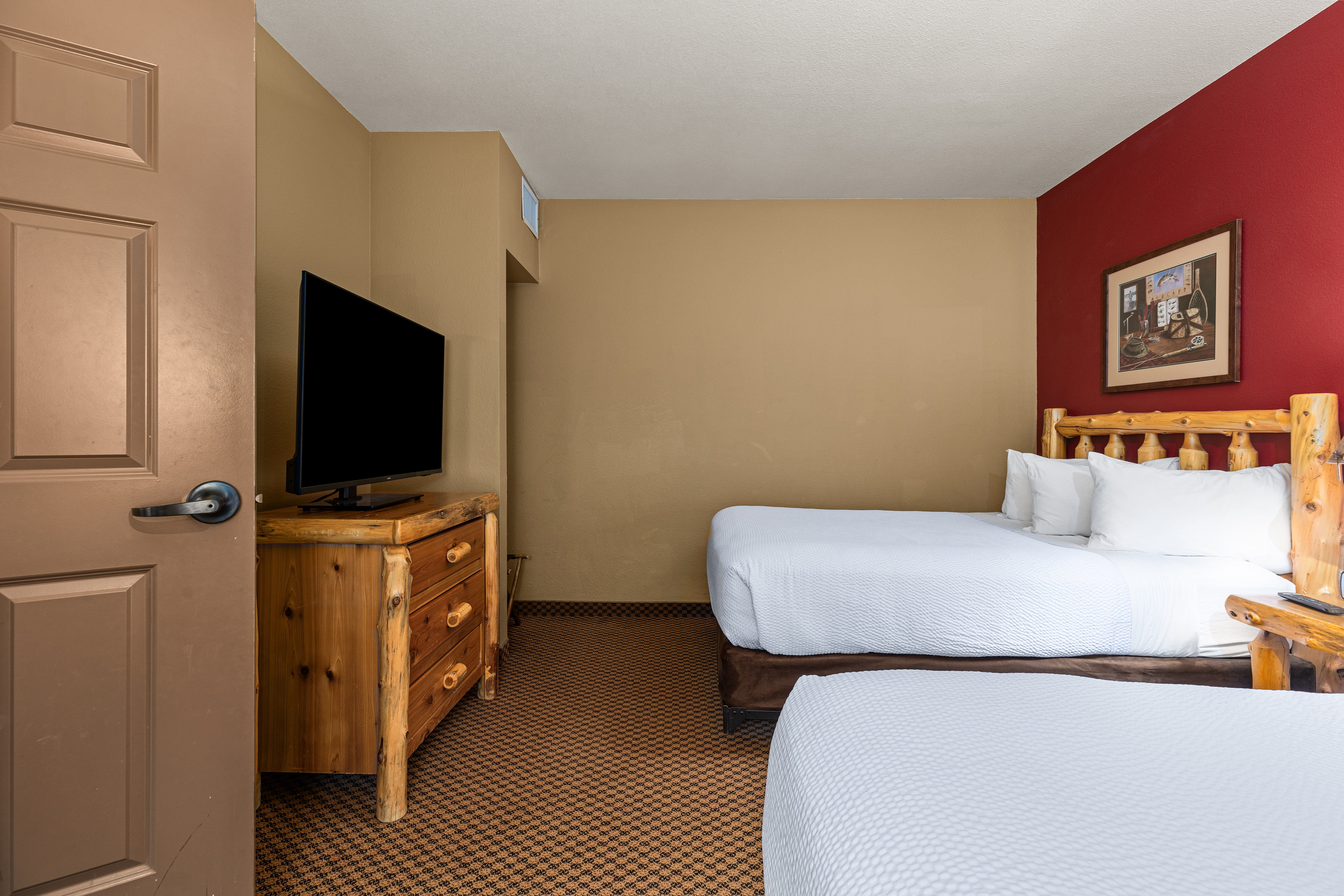 King bed guest room at the The Lodge at Brainerd Lakes, Trademark Collection by Wyndham in Baxter, Minnesota
