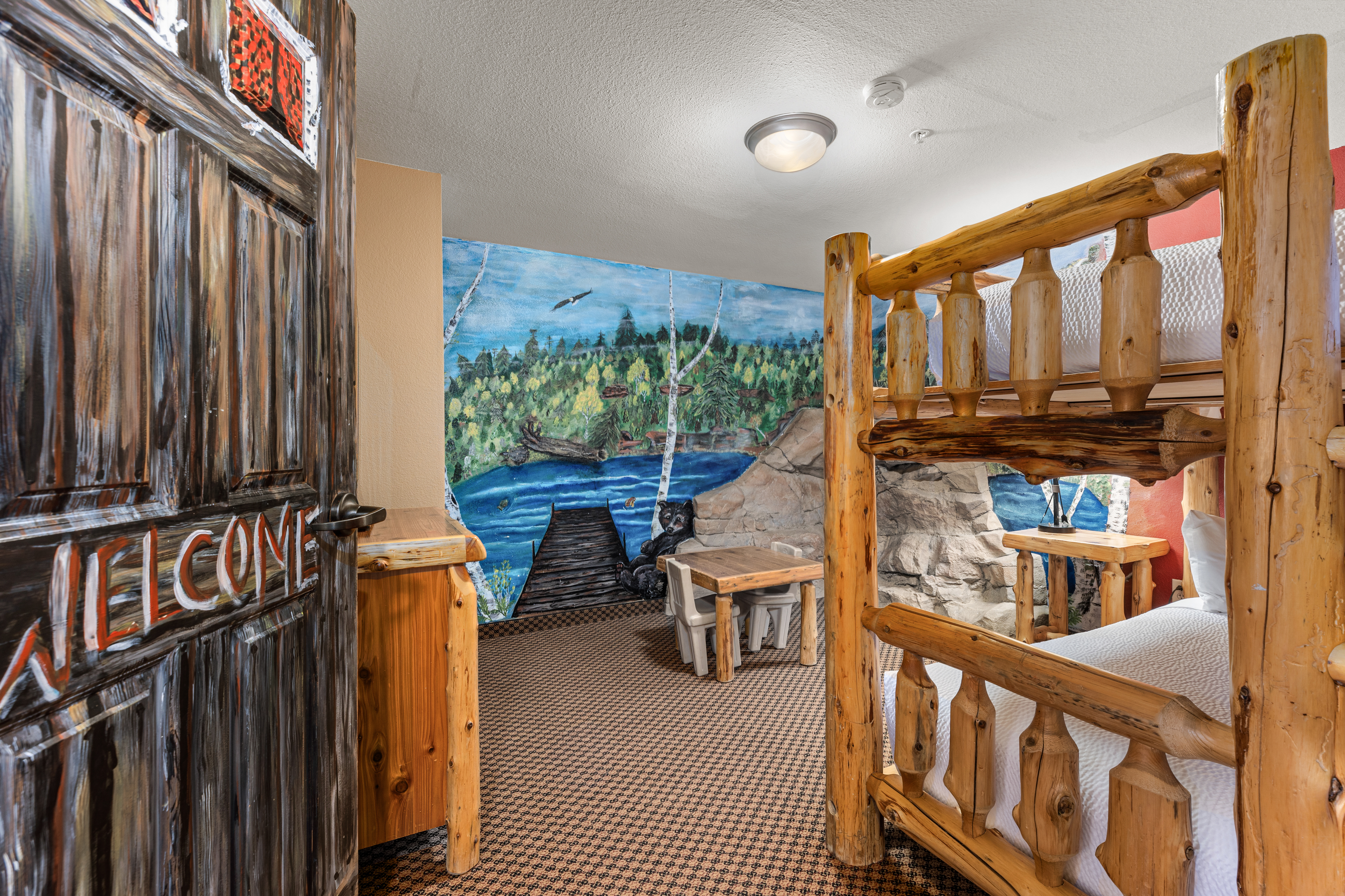 King bed guest room at the The Lodge at Brainerd Lakes, Trademark Collection by Wyndham in Baxter, Minnesota