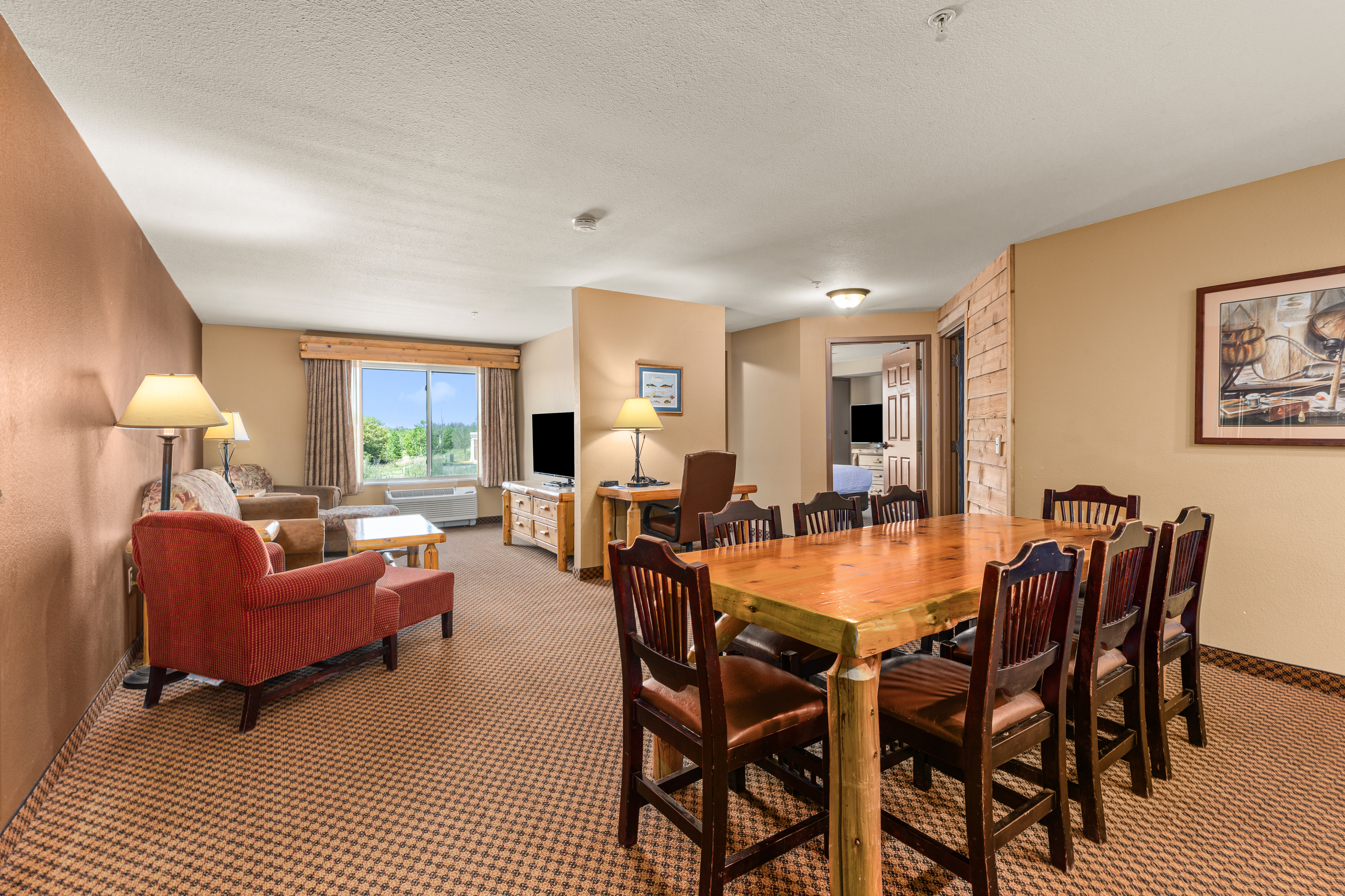 King bed guest room at the The Lodge at Brainerd Lakes, Trademark Collection by Wyndham in Baxter, Minnesota