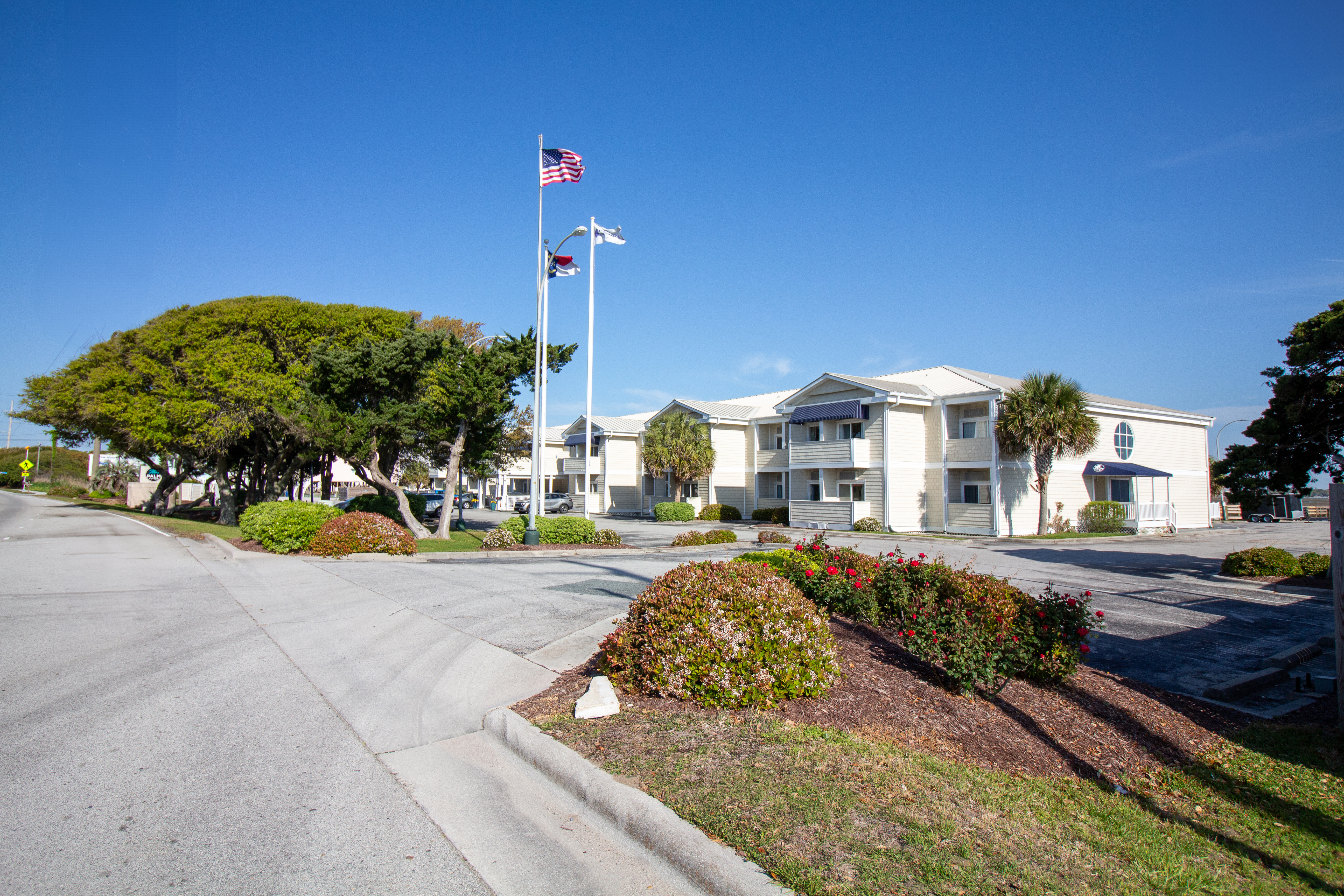 Exterior of Palm Suites Trademark Collection by Wyndham hotel in Atlantic Beach, North Carolina