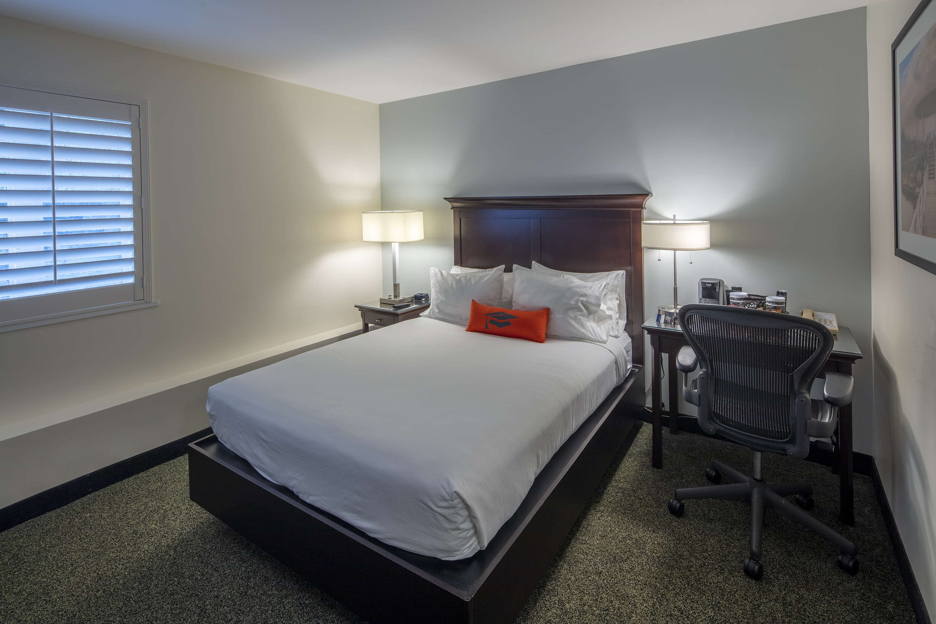 Guest room at the Collegian Hotel & Suites, Trademark Collection by Wyndham in Syracuse, New York