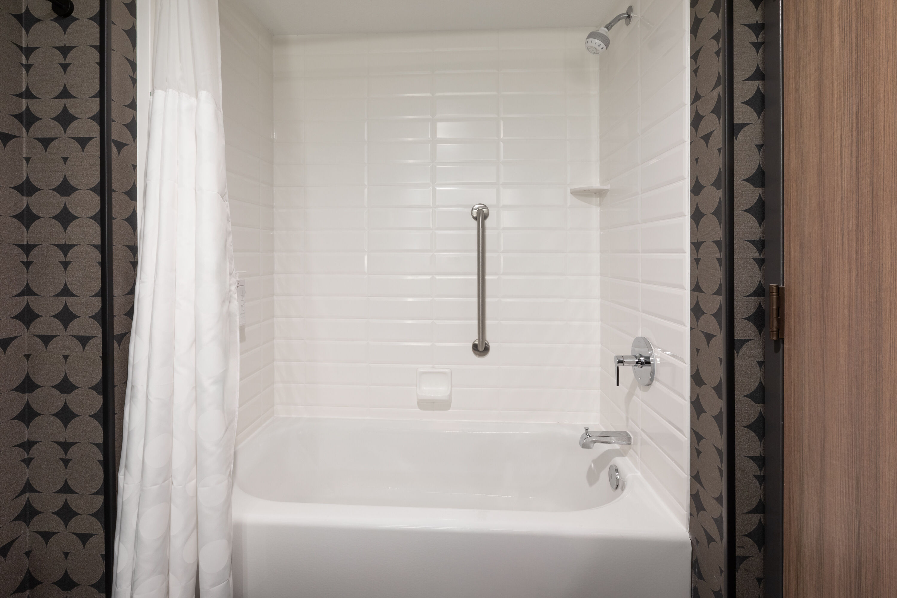 Guest room bath at the Riverbend Hotel and Suites, Trademark Collection by Wyndham in Ashtabula, Ohio