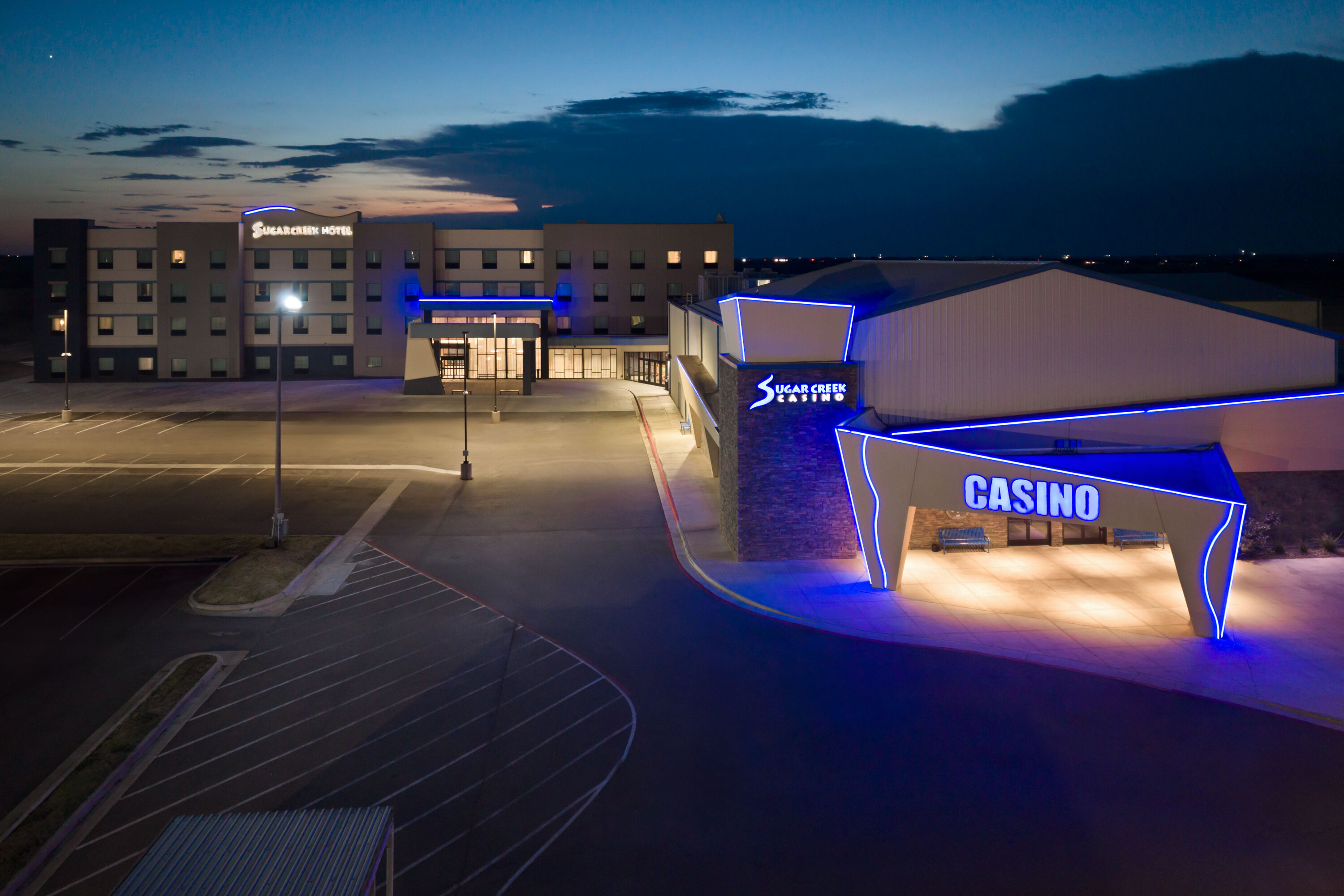 Exterior Dusk Image of Sugar Creek Hotel, Trademark Collection by Wyndham hotel in Hinton, Oklahoma