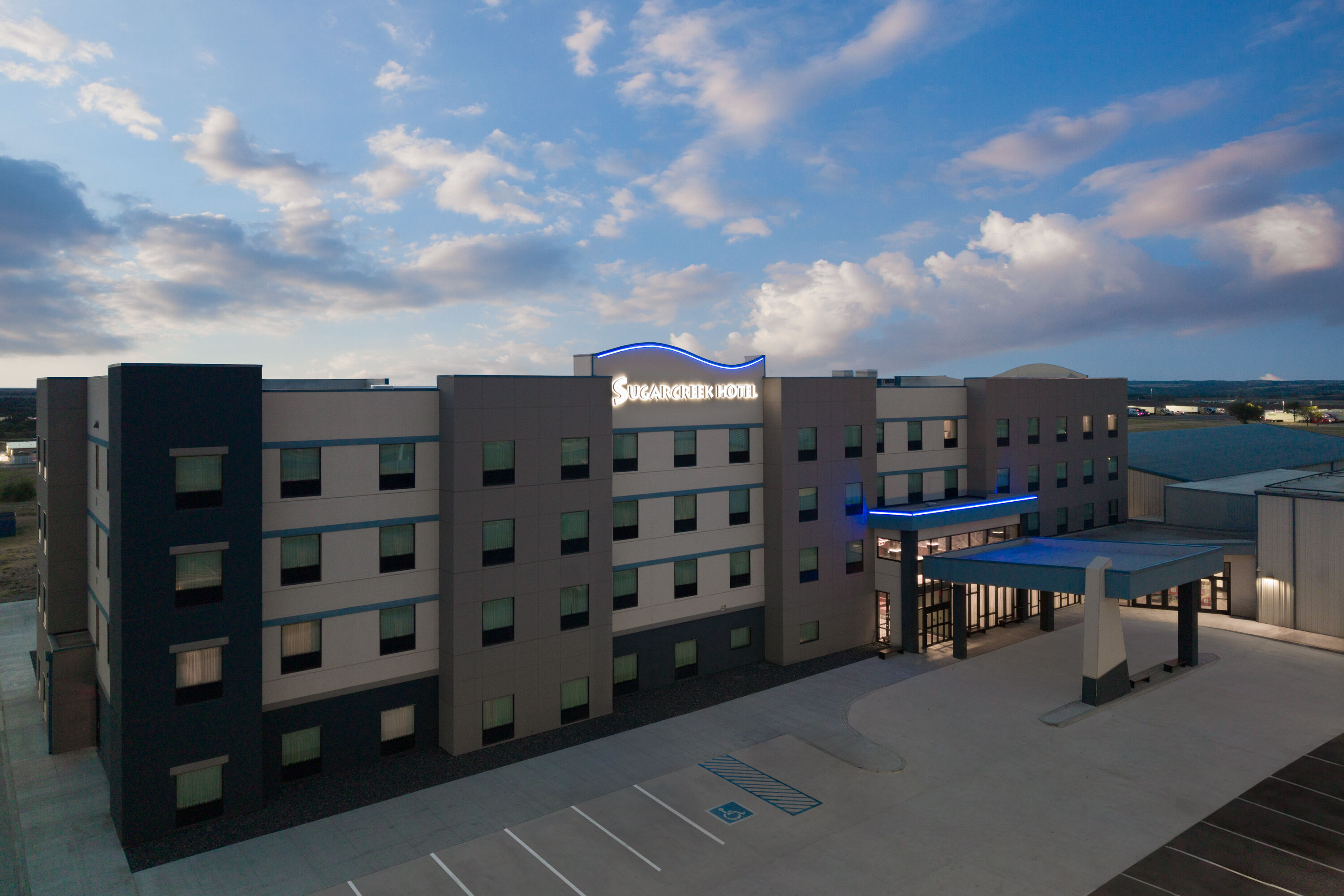Exterior Dusk Image of Sugar Creek Hotel, Trademark Collection by Wyndham hotel in Hinton, Oklahoma