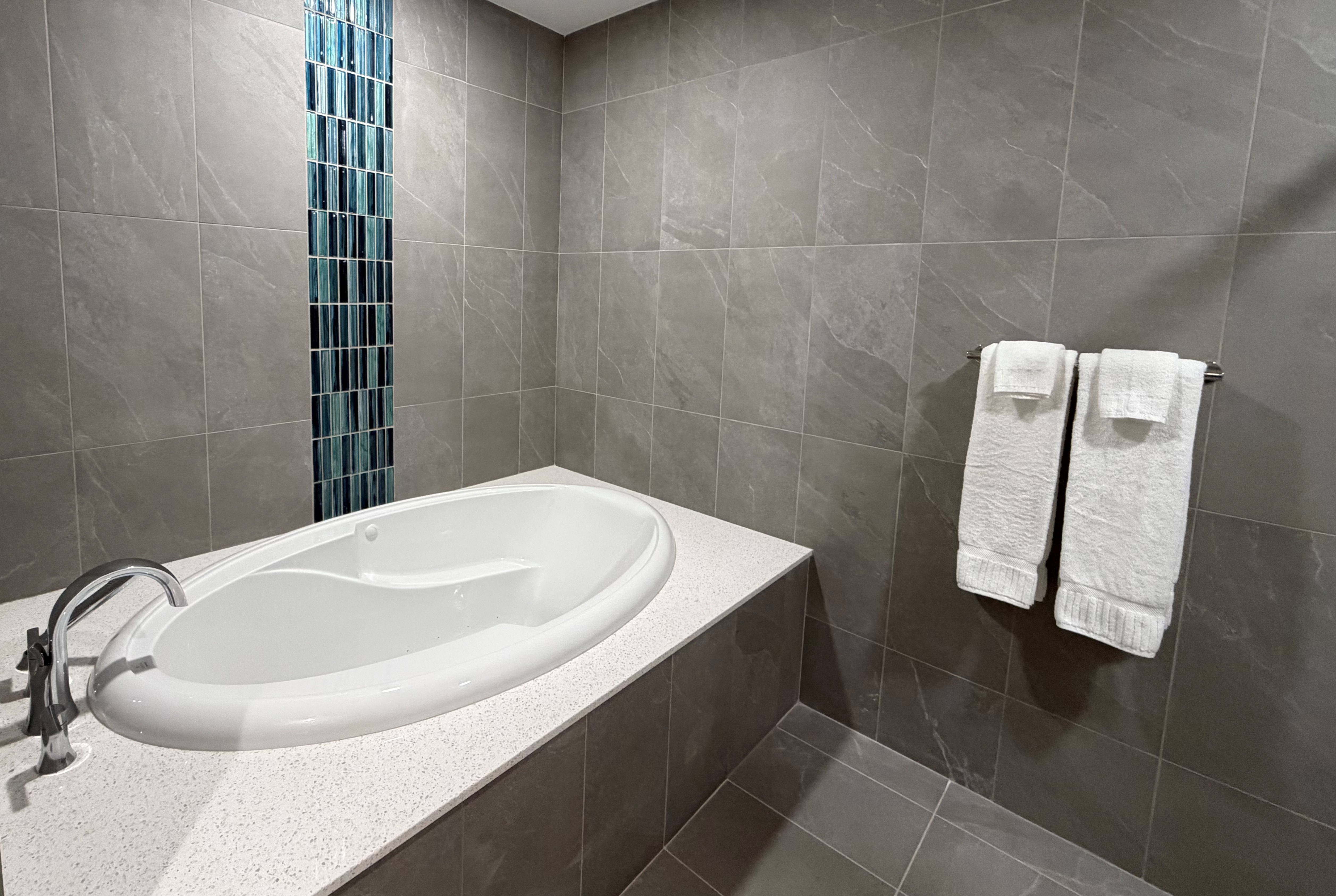 Guest room bath at the Sugar Creek Hotel, Trademark Collection by Wyndham in Hinton, Oklahoma