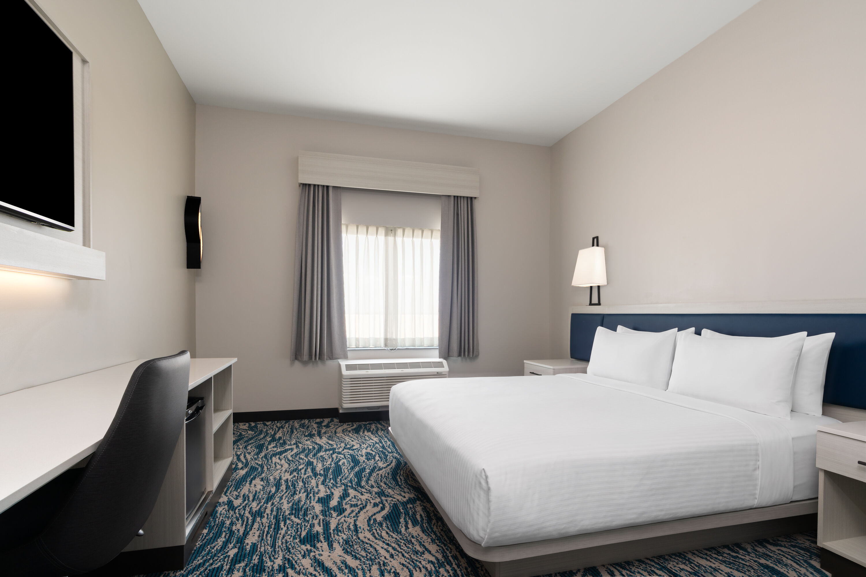 Guest room at the Sugar Creek Hotel, Trademark Collection by Wyndham in Hinton, Oklahoma