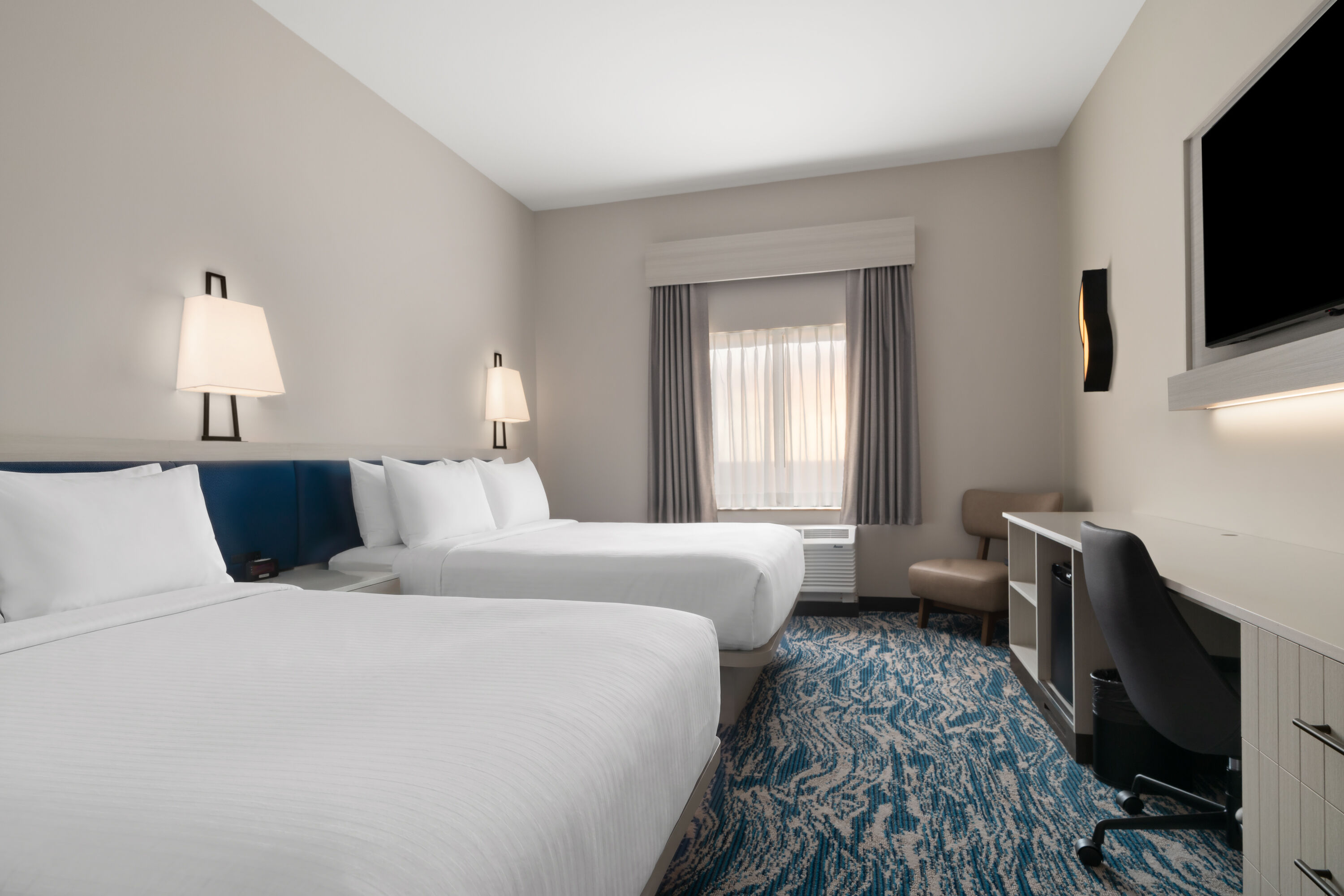 Guest room at the Sugar Creek Hotel, Trademark Collection by Wyndham in Hinton, Oklahoma