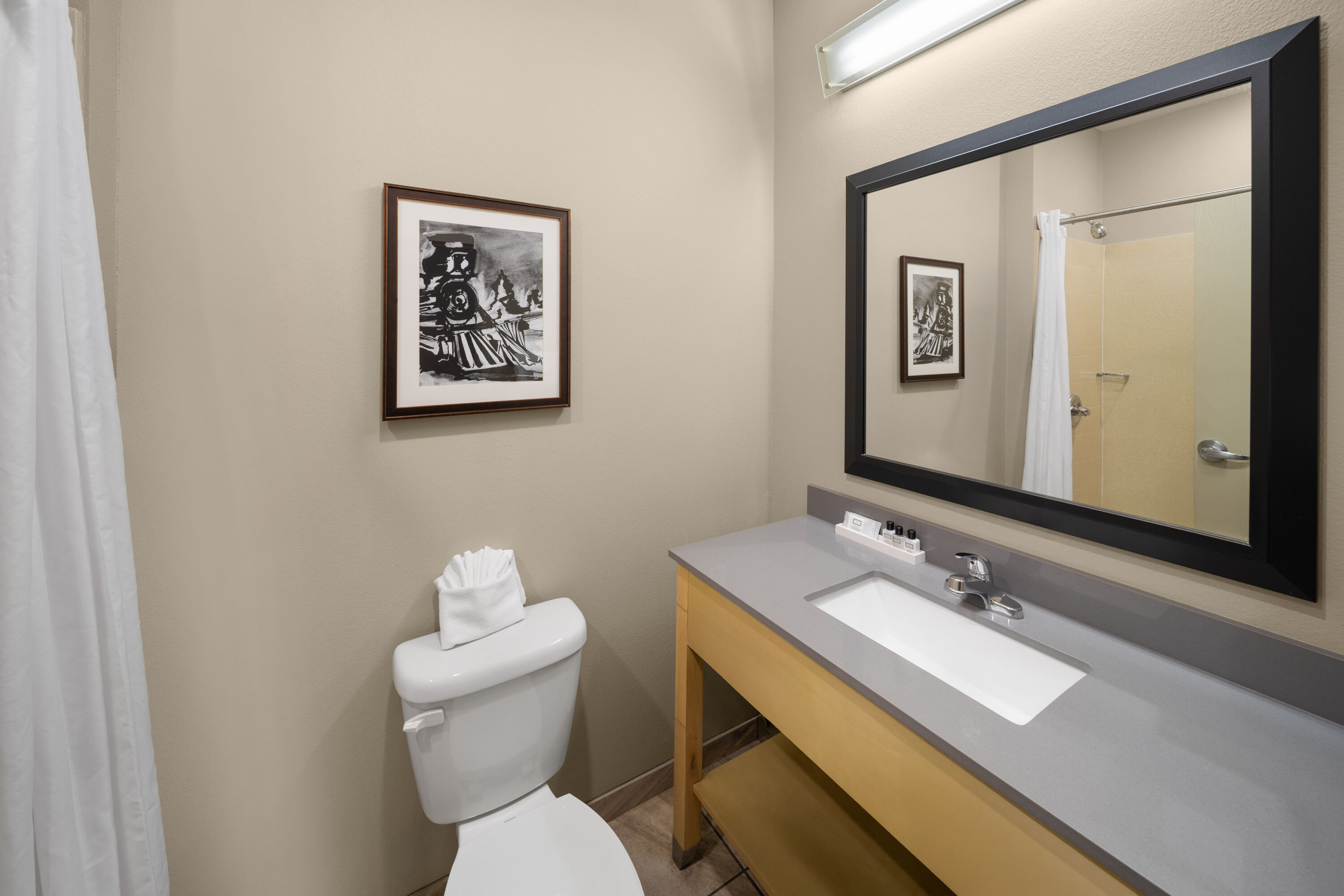 Guest room bath at the StoneHill Norman, Trademark Collection by Wyndham in Norman, Oklahoma