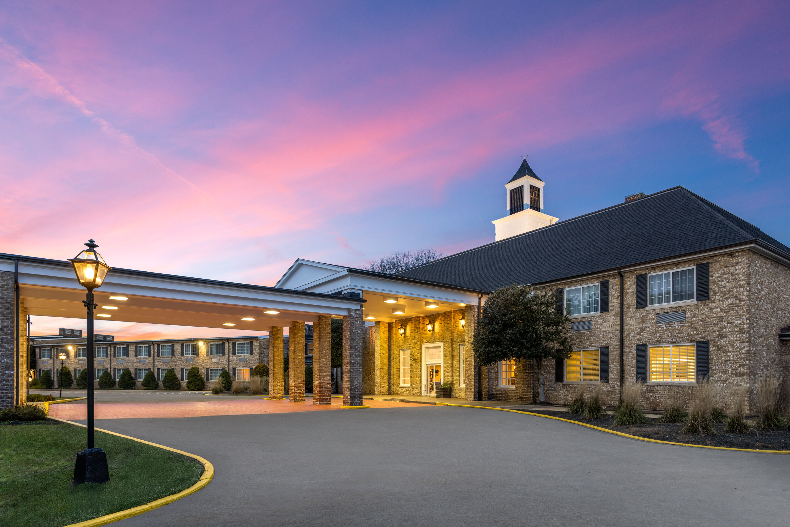Exterior Dusk Image of Penn Harris Hotel Harrisburg, Trademark by Wyndham hotel in Camp Hill, Pennsylvania