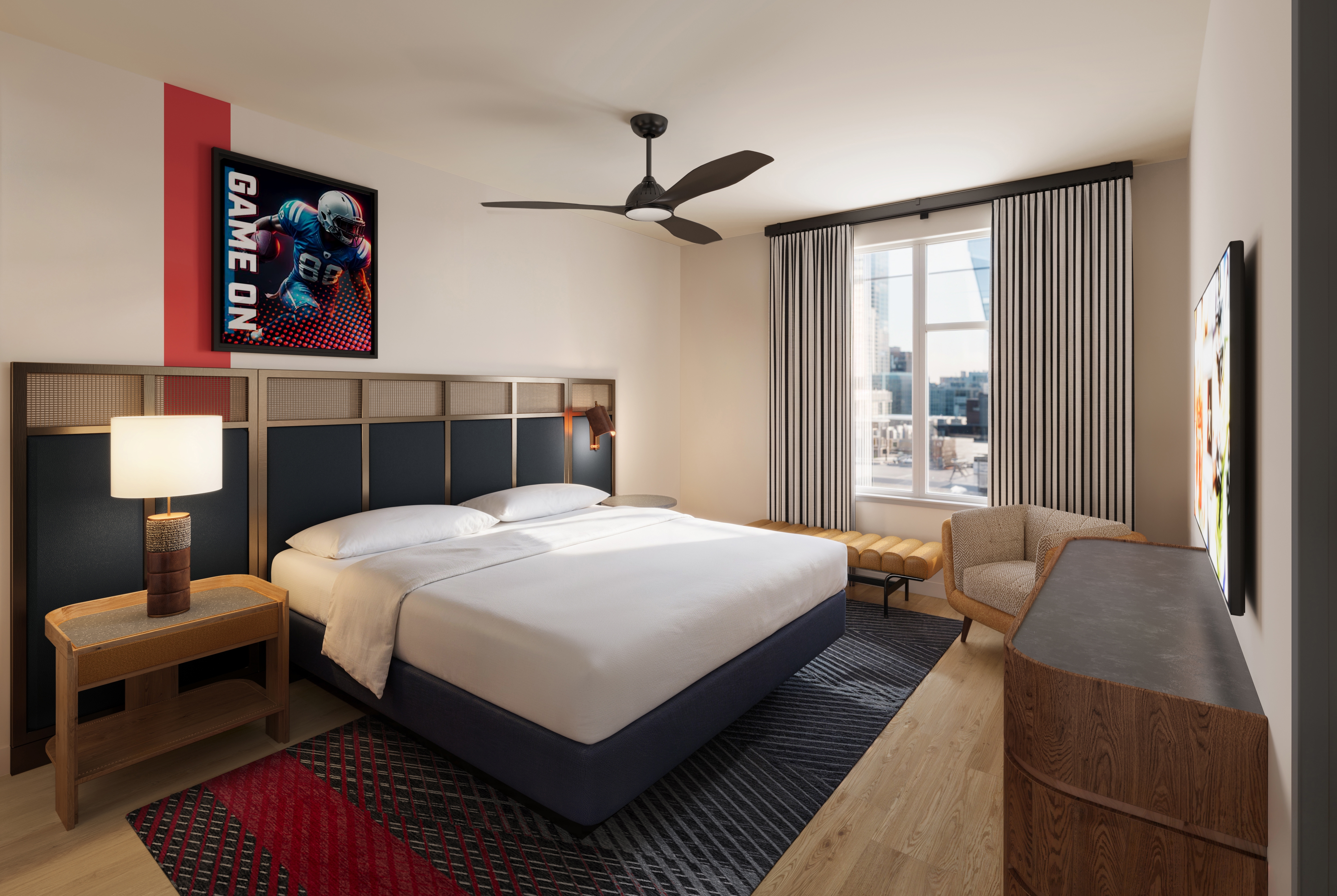 King bed guest room at the Sports Illustrated Resorts Nashville Music Row in Nashville, Tennessee