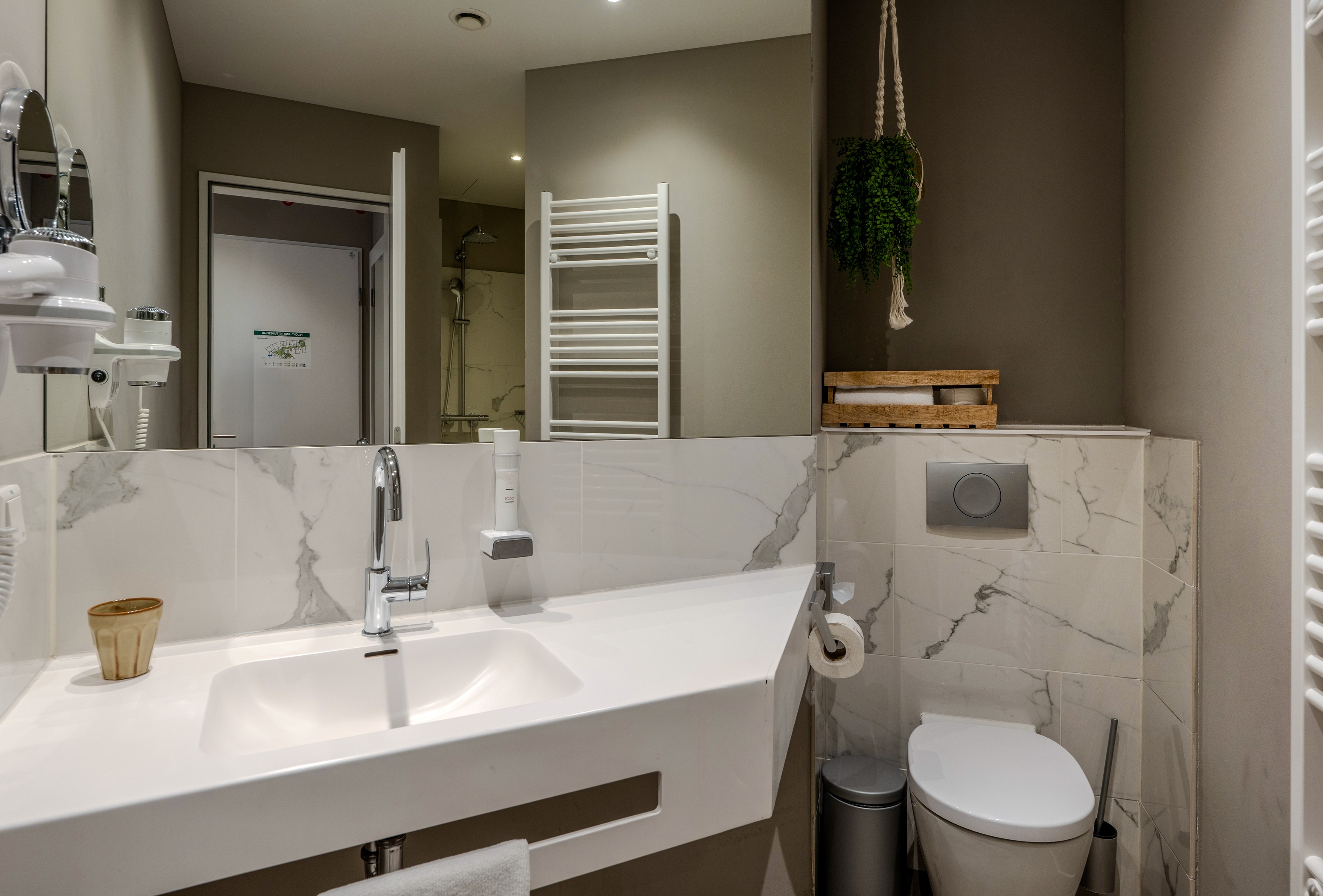 Guest room bath at the Vienna House by Wyndham Frankfurt South in Frankfurt am Main, Other than US/Canada