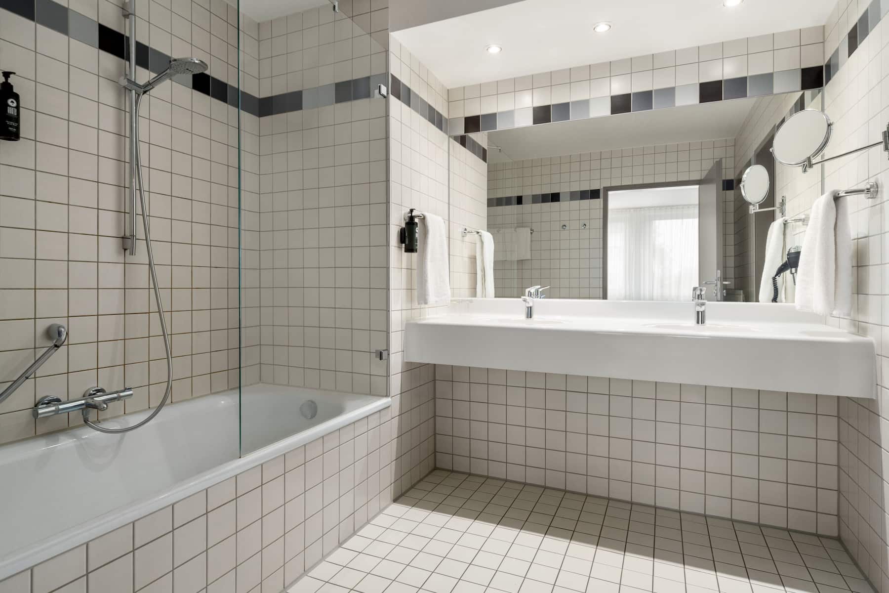 Guest room bath at the Vienna House Easy by Wyndham Gunzburg in Gunzburg, Other than US/Canada