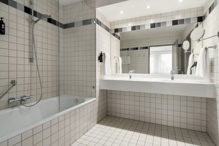 Guest room bath at the Vienna House Easy by Wyndham Gunzburg in Gunzburg, Other than US/Canada