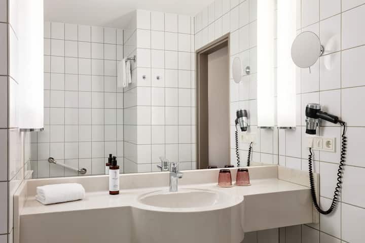 Guest room bath at the Vienna House Easy by Wyndham Limburg in Limburg, Other than US/Canada