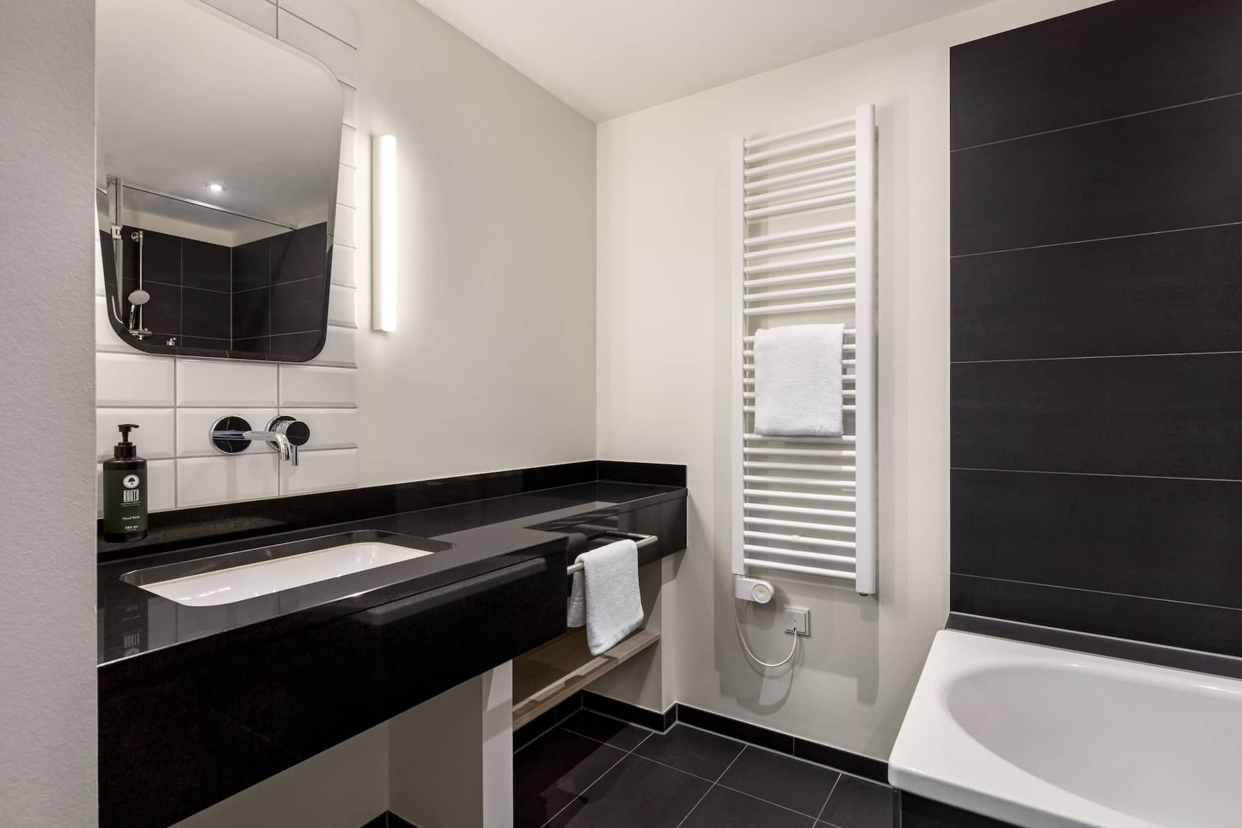 Guest room bath at the Vienna House Easy by Wyndham Osnabruck in Osnabrueck, Other than US/Canada