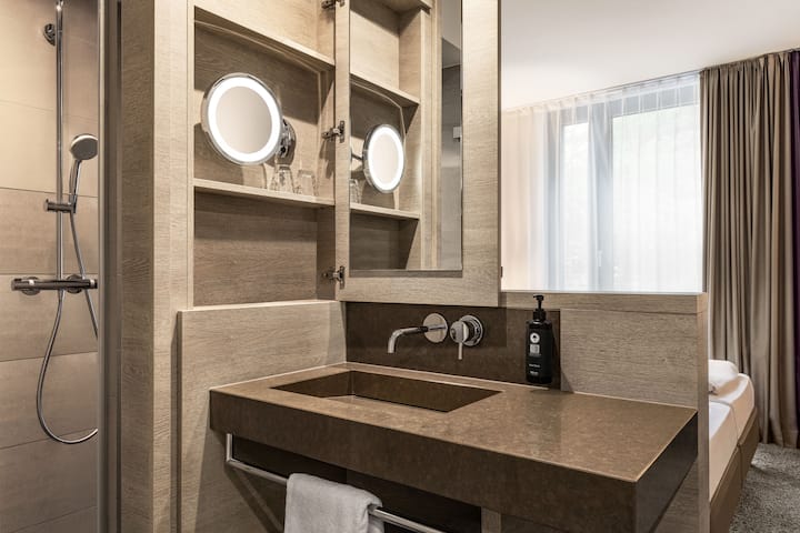 Guest room bath at the Vienna House Easy by Wyndham Osnabruck in Osnabrueck, Other than US/Canada