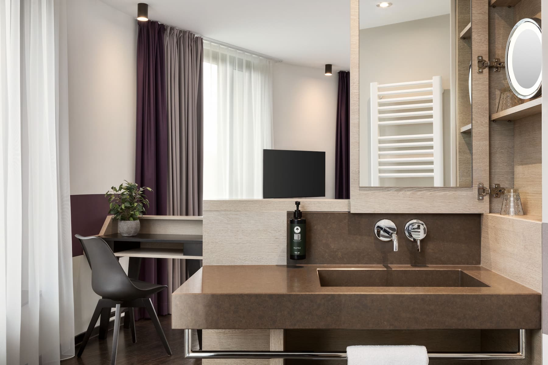 Guest room bath at the Vienna House Easy by Wyndham Osnabruck in Osnabrueck, Other than US/Canada