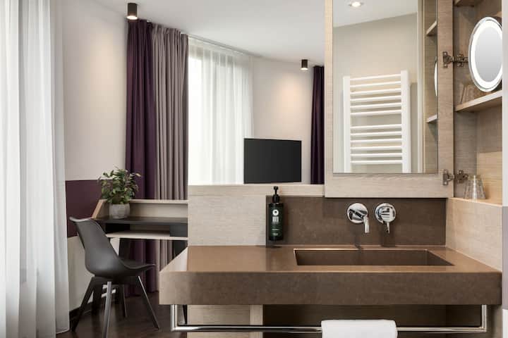 Guest room bath at the Vienna House Easy by Wyndham Osnabruck in Osnabrueck, Other than US/Canada