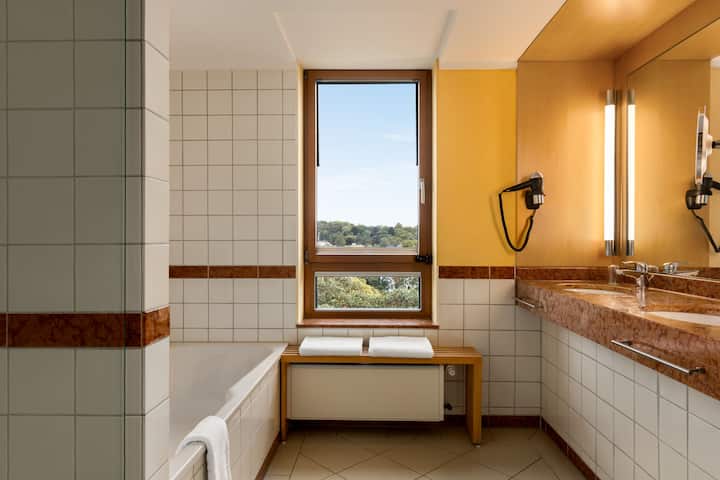 Guest room bath at the Vienna House by Wyndham Remarque Osnabruck in Osnabrueck, Other than US/Canada
