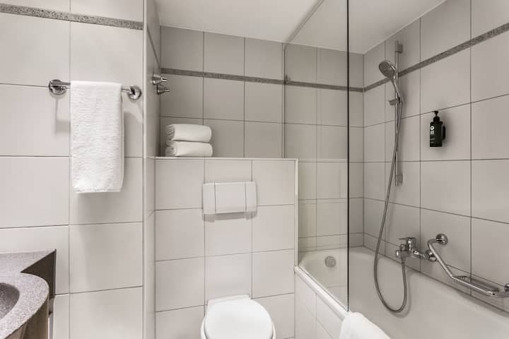 Guest room bath at the Vienna House Easy by Wyndham Trier in Trier, Other than US/Canada