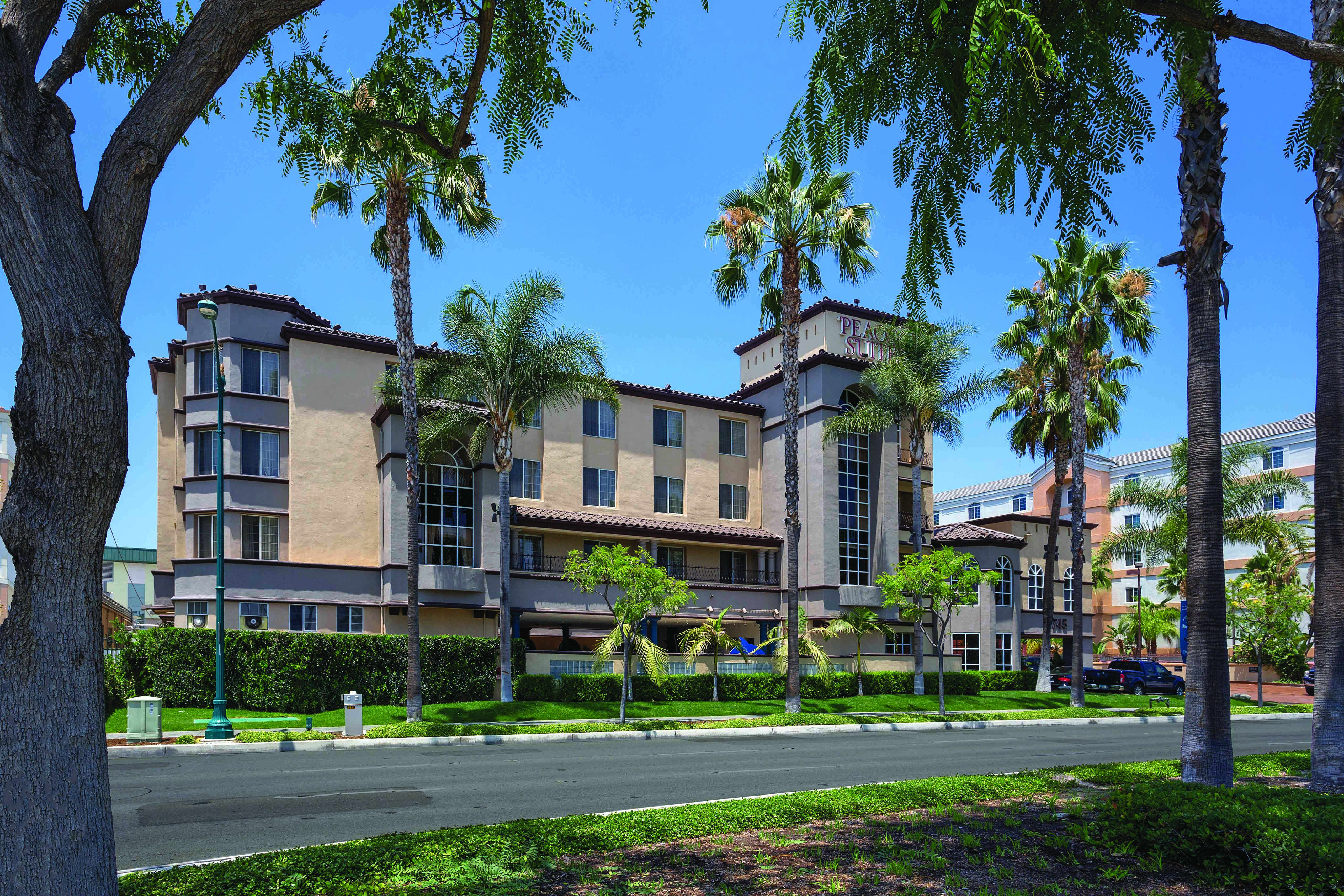 Exterior of Peacock Suites hotel in Anaheim, California