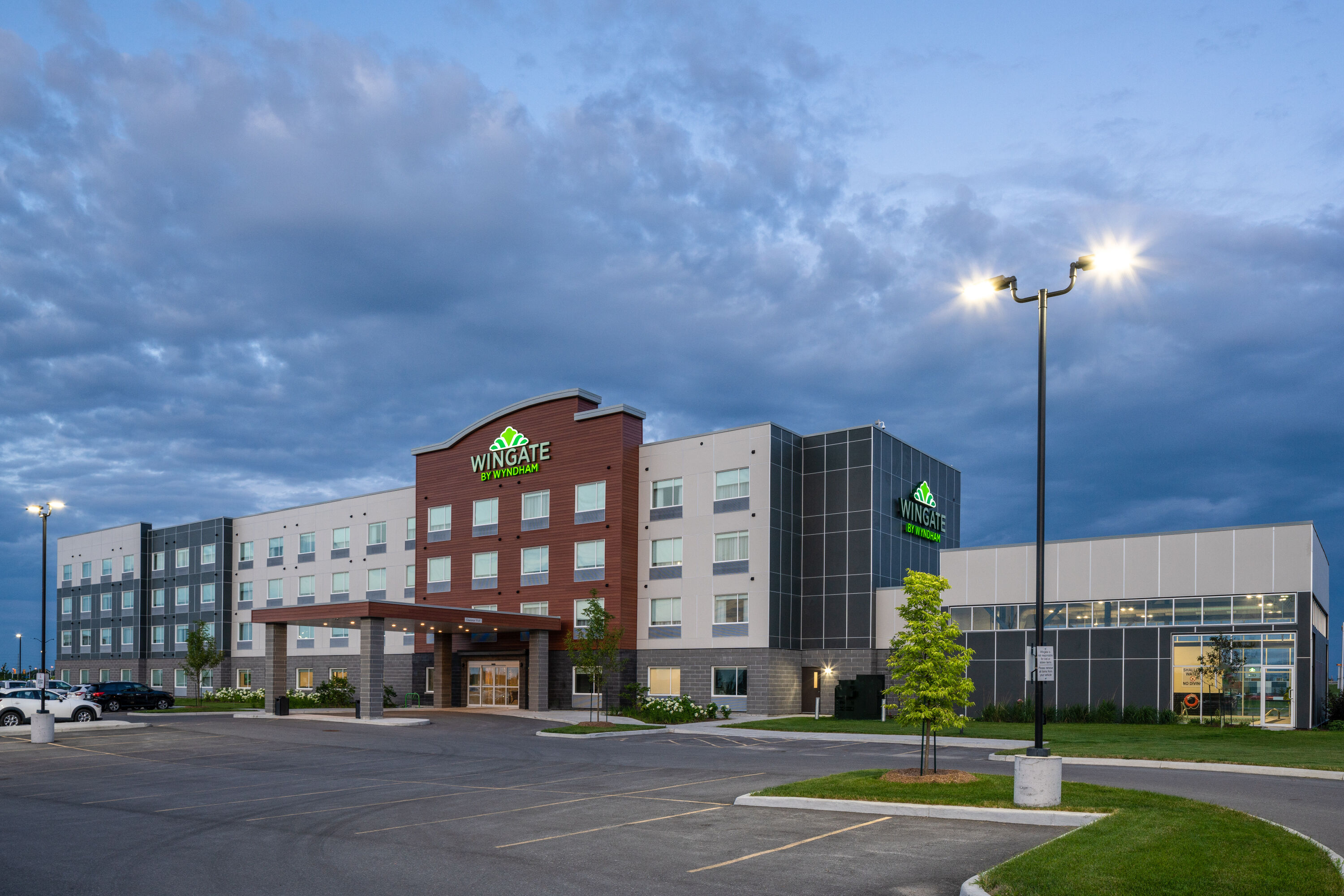 Exterior Dusk Image of Wingate by Wyndham Kanata West Ottawa hotel in Kanata, Ontario