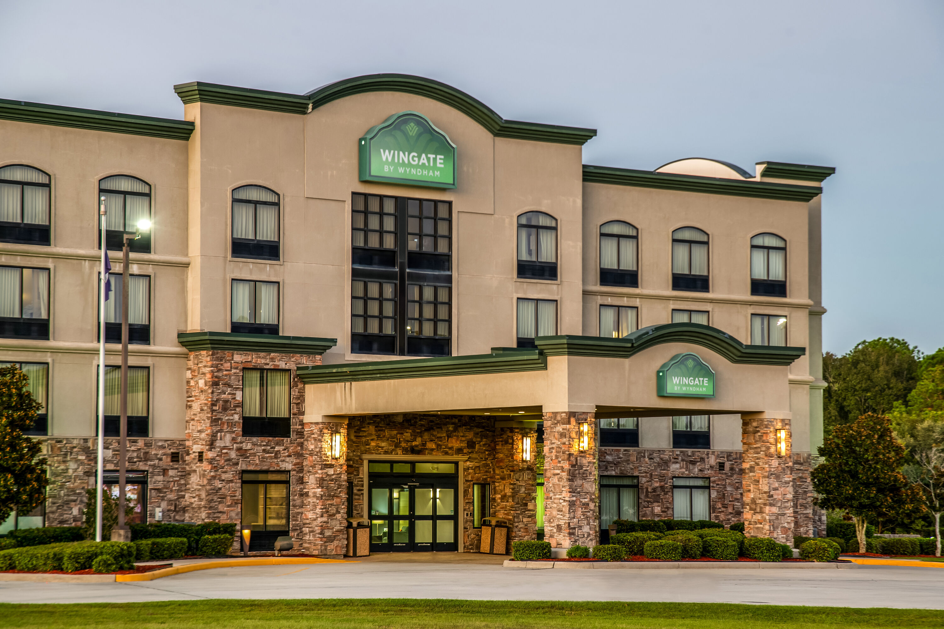 Exterior Dusk Image of Wingate by Wyndham Slidell/New Orleans East Area hotel in Slidell, Louisiana