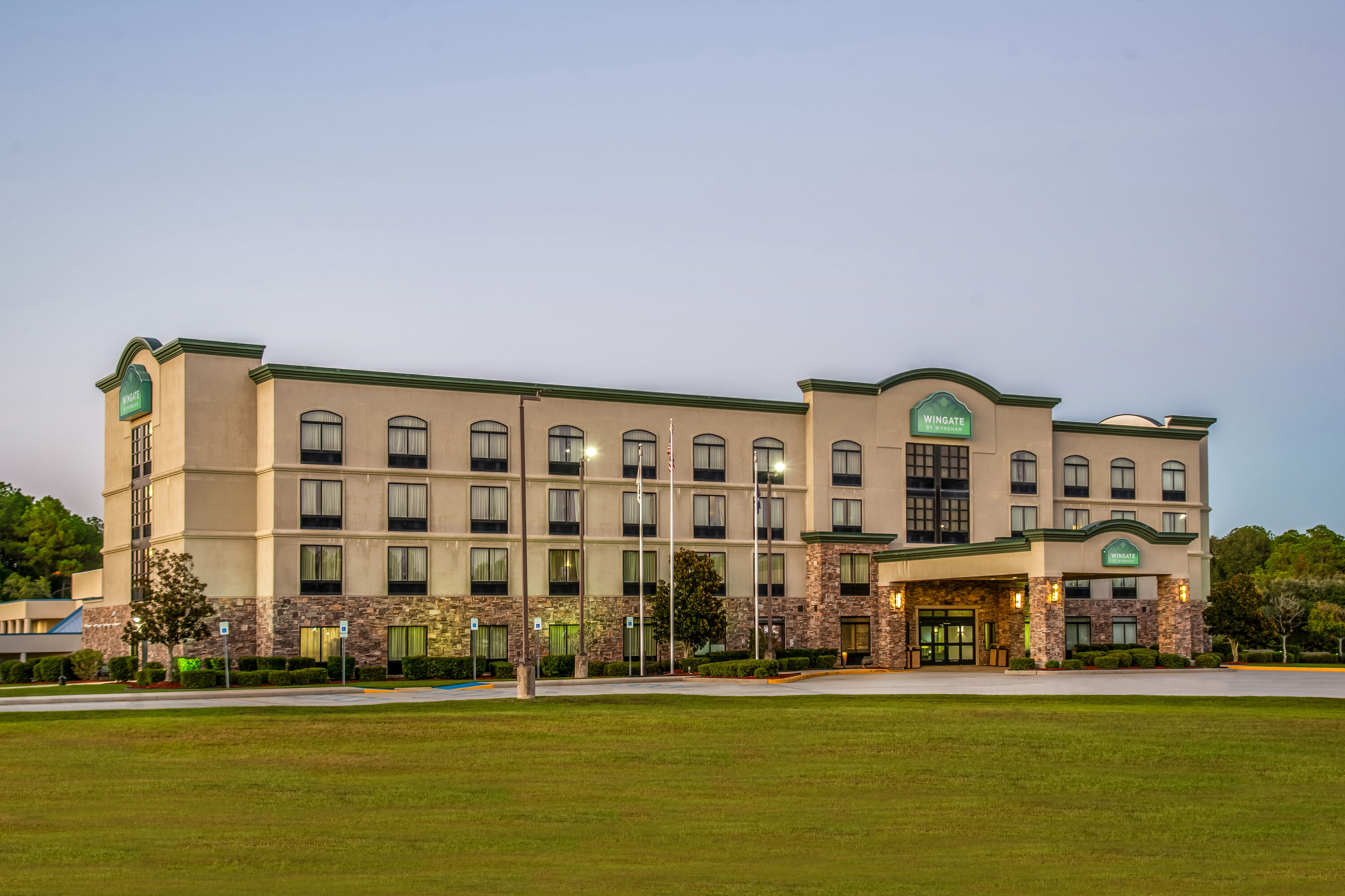 Exterior Dusk Image of Wingate by Wyndham Slidell/New Orleans East Area hotel in Slidell, Louisiana