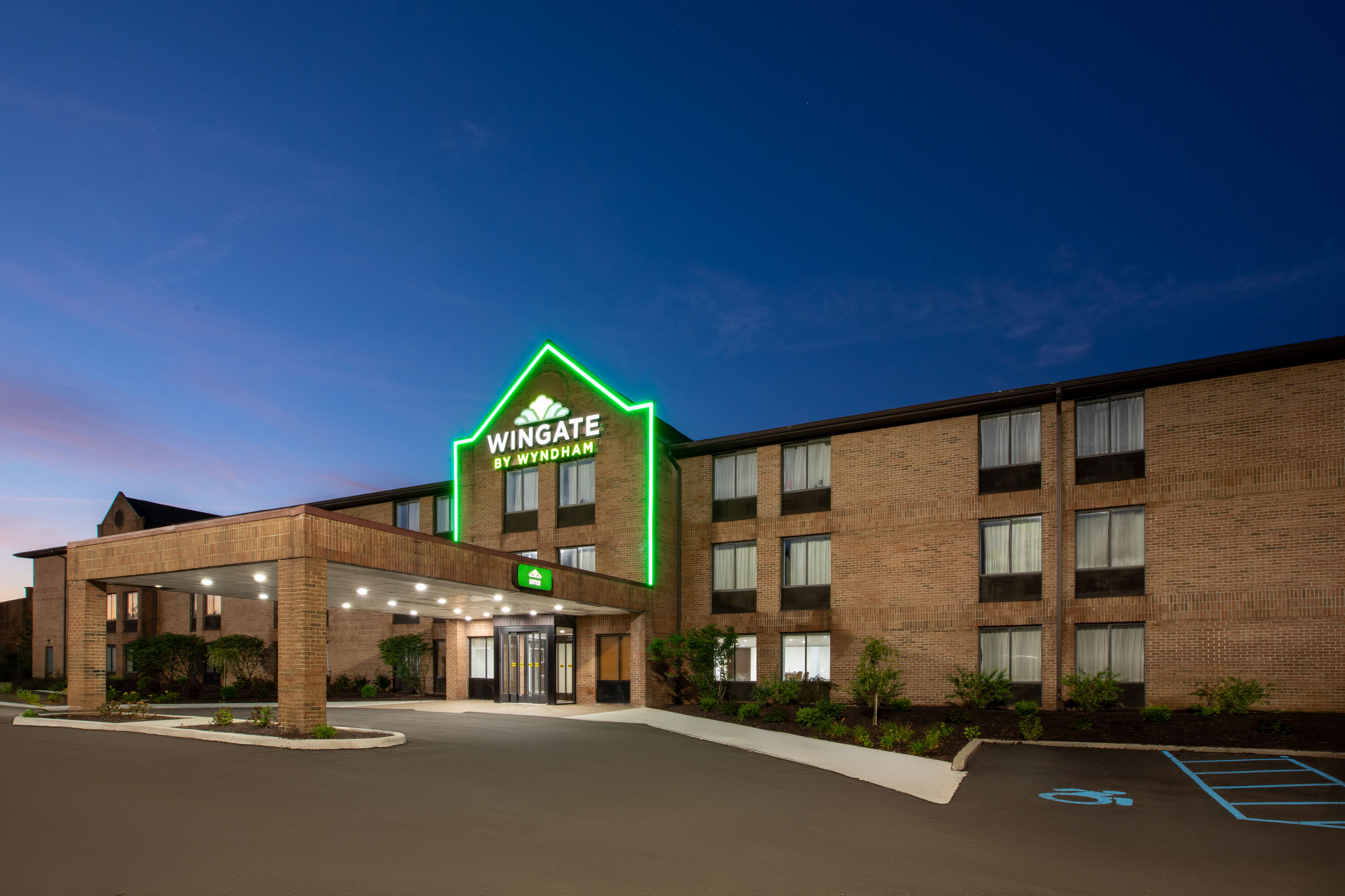Exterior Dusk Image of Wingate by Wyndham Livonia hotel in Livonia, Michigan