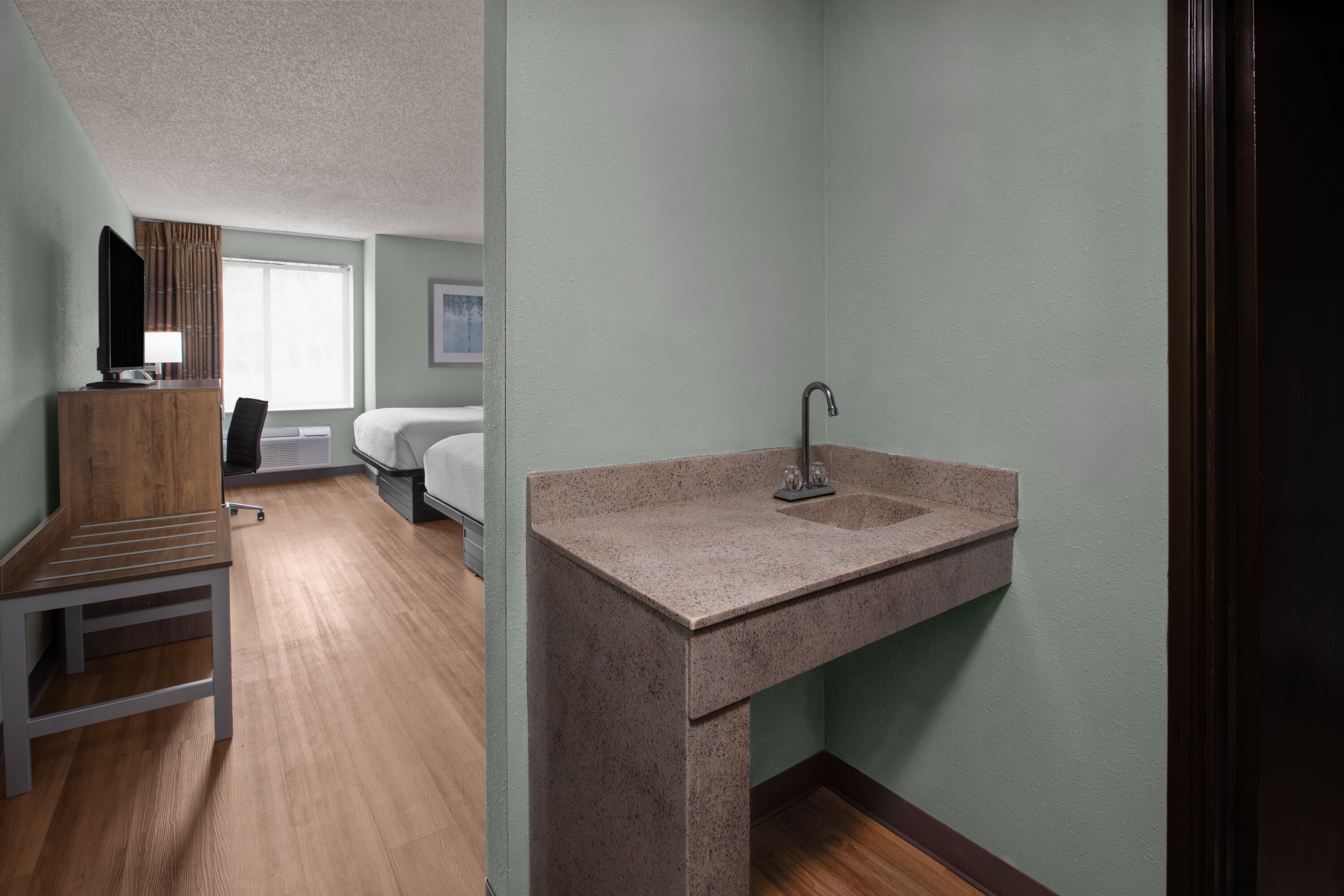 Guest room at the Wingate by Wyndham Livonia in Livonia, Michigan