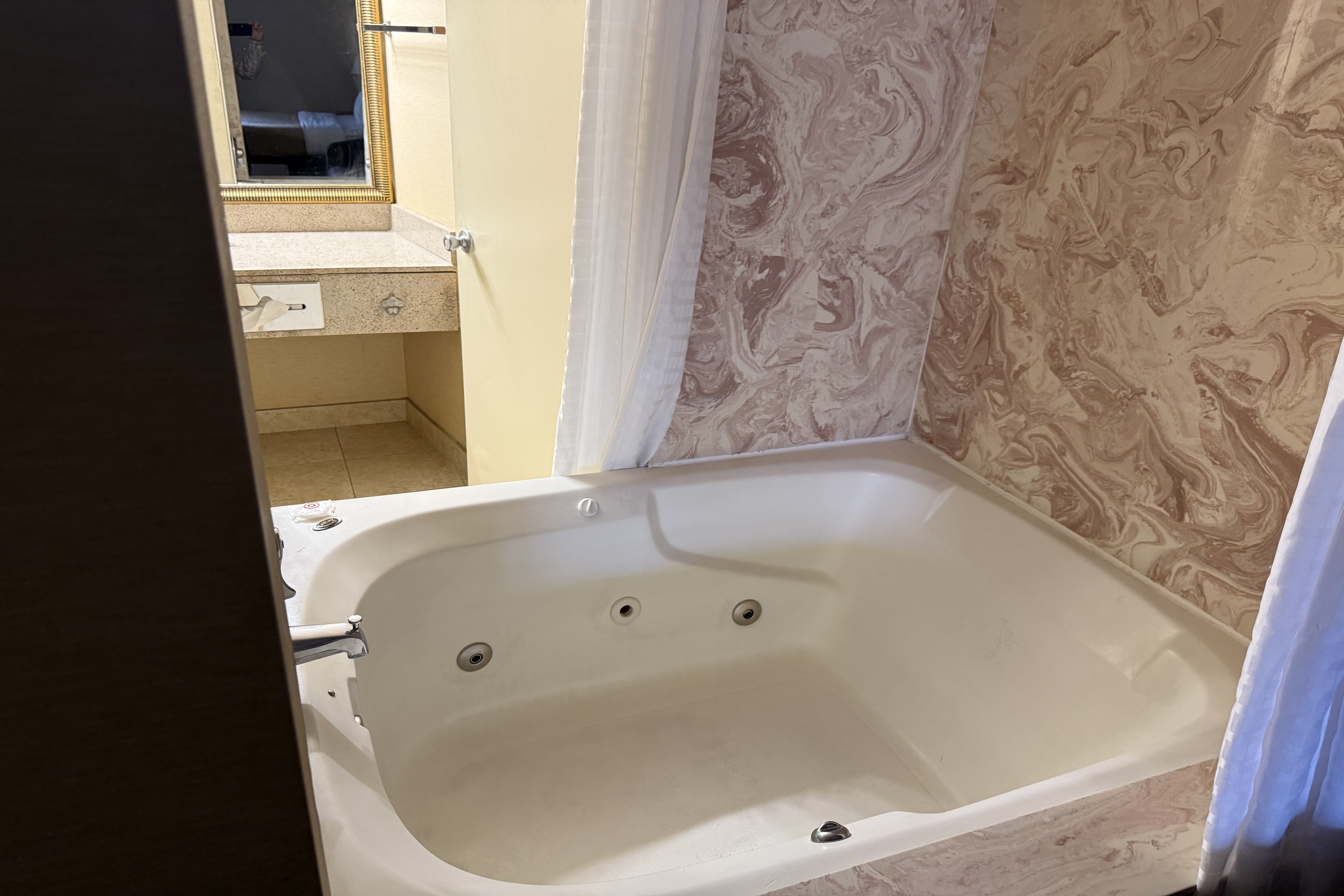Guest room bath at the Wingate by Wyndham Livonia in Livonia, Michigan