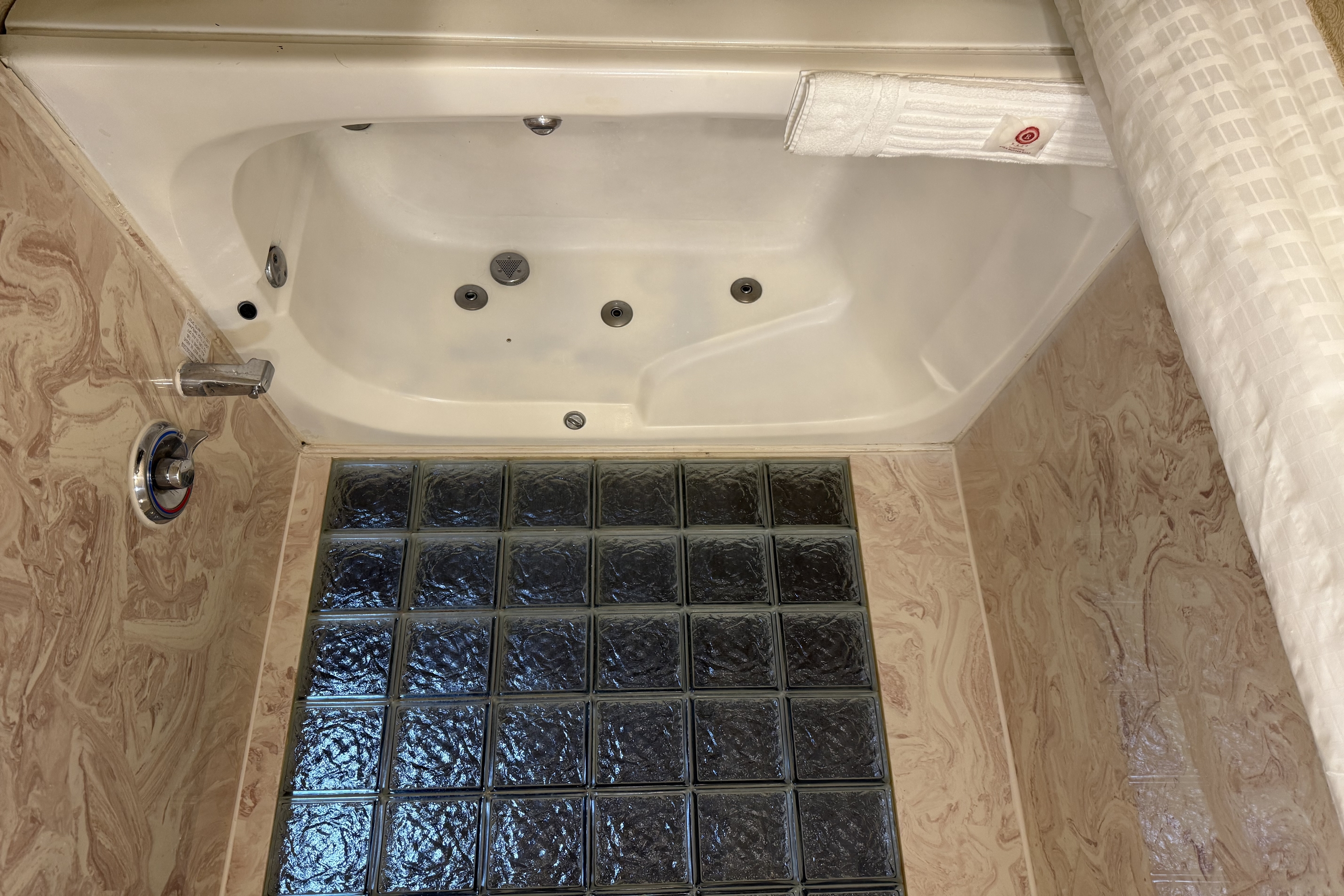 Guest room bath at the Wingate by Wyndham Livonia in Livonia, Michigan