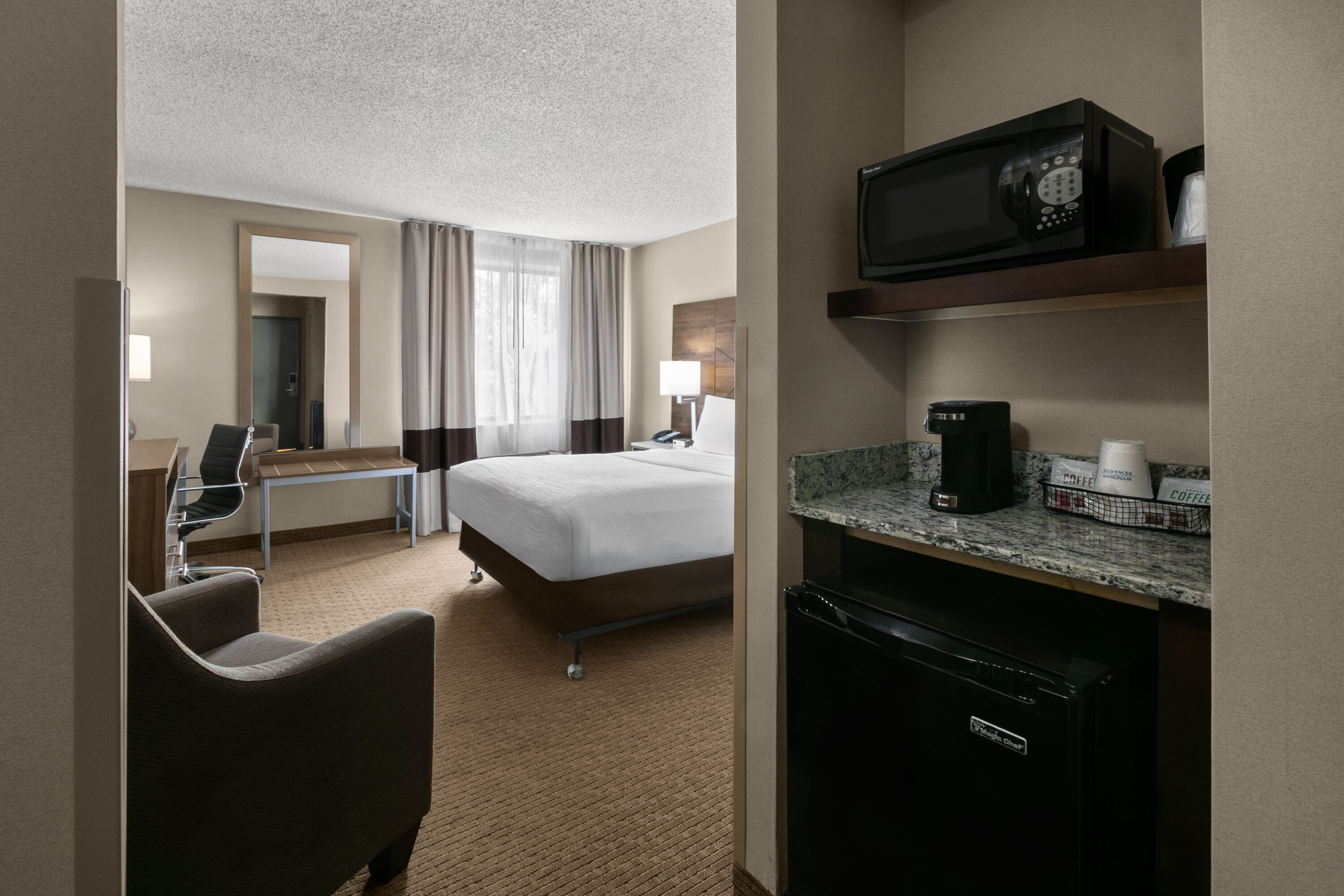 Guest room at the Wingate by Wyndham Utica in Utica, Michigan